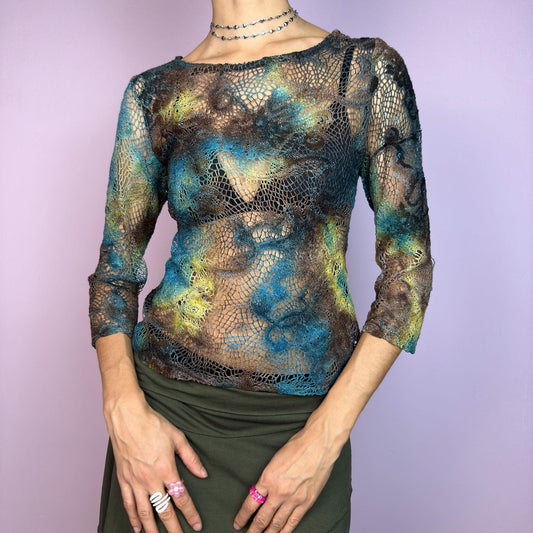 The Y2K Open Knit Mesh Top is a unique vintage 2000s piece featuring an intricate open-knit design, this semi-sheer top boasts a dreamy tie-dye-inspired blend of earthy hues in brown, blue and green. adult world shop