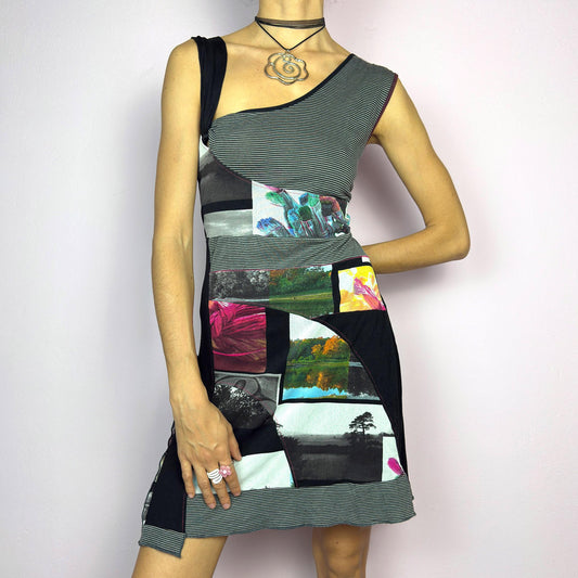 The Y2K Patchwork Sleeveless Mini Dress is a vintage 2000s asymmetrical black dress featuring a bold patchwork design with mixed prints, stripes, and photo graphics. Crafted from a stretchy fabric. adult world shop