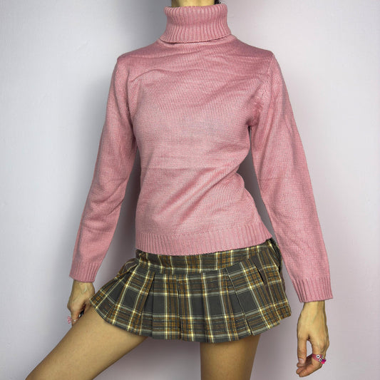 This Y2K Pink Turtleneck Sweater is a cozy 2000s essential with a minimalist vintage aesthetic. Crafted from a soft, knit fabric in a muted pastel pink, it features a classic high turtleneck, a fitted silhouette for a flattering look and long sleeves with ribbed cuffs. Ideal for casual or preppy winter styles. adult world shop