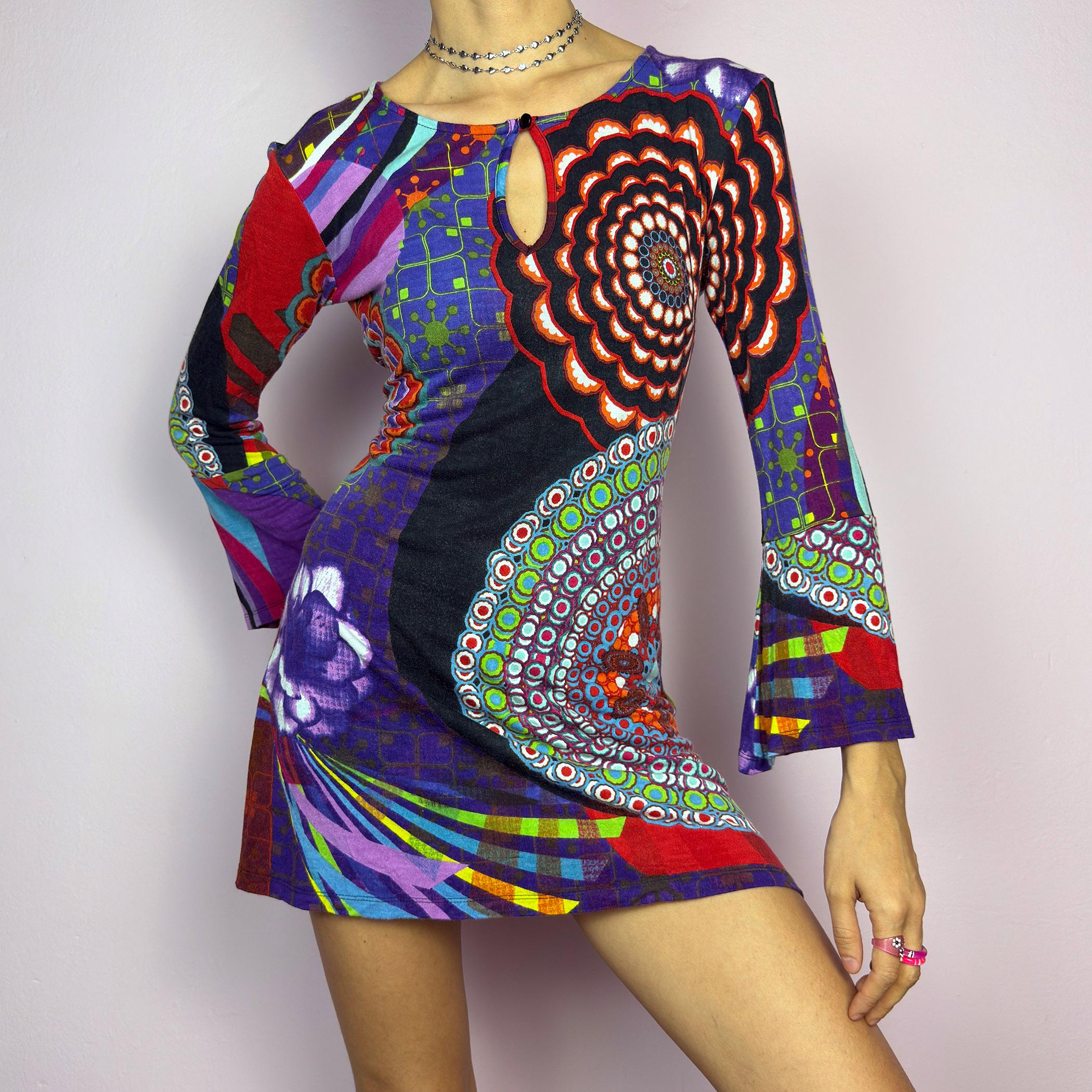 The Y2K Psychedelic Print Mini Dress is a statement 2000s piece, featuring a bold and colorful abstract pattern with a mix of geometric and floral designs and is crafted from a stretchy fabric. adult world shop