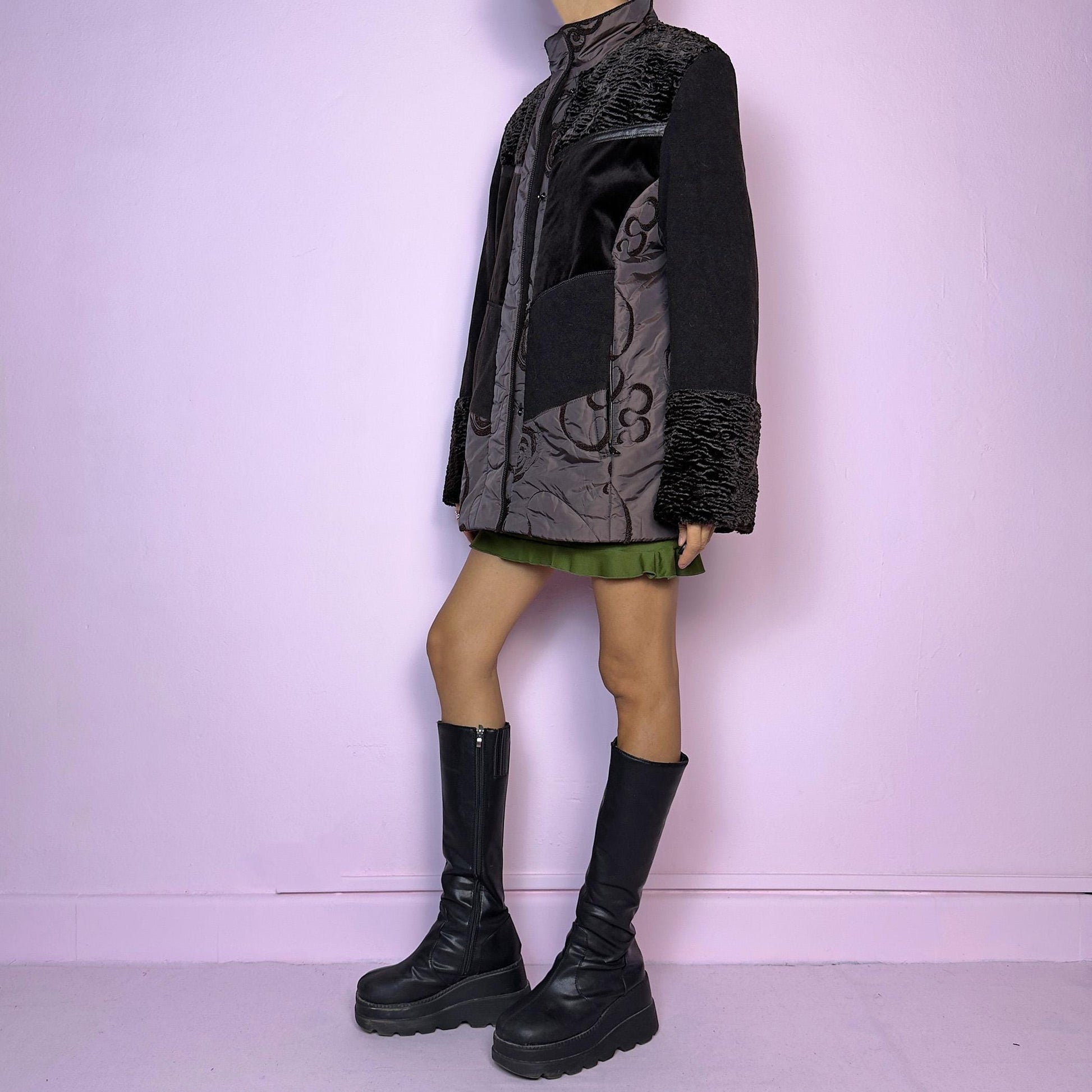 The Y2K Brown Contrast Panel Jacket is a vintage 2000s piece featuring a striking mixed-material design in dark brown with textured panels, including quilted, faux fur, and velvety fabric sections. It comes with a zipper and snap button closure