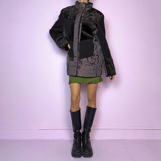 The Y2K Brown Contrast Panel Jacket is a vintage 2000s piece featuring a striking mixed-material design in dark brown with textured panels, including quilted, faux fur, and velvety fabric sections. It comes with a zipper and snap button closure