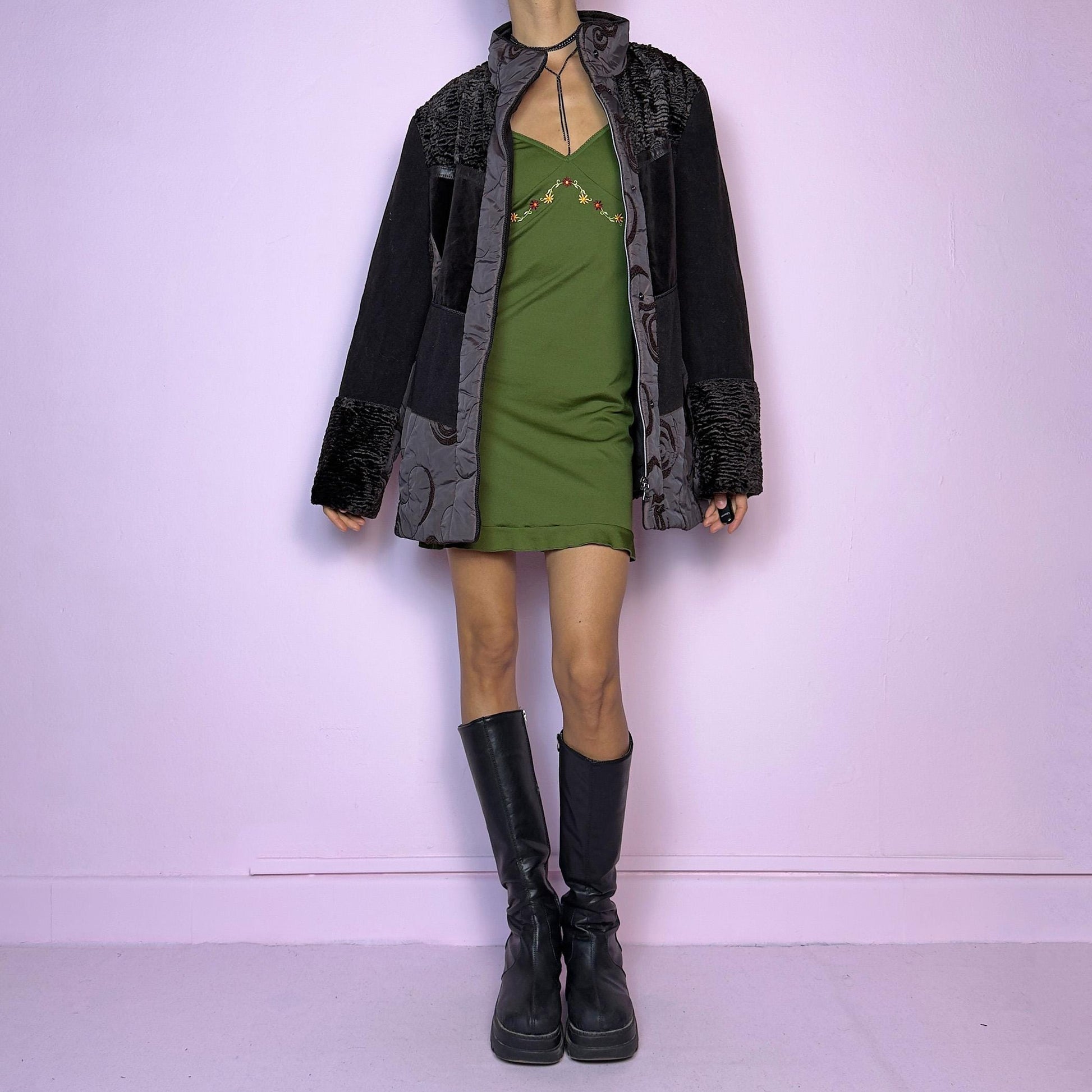 The Y2K Brown Contrast Panel Jacket is a vintage 2000s piece featuring a striking mixed-material design in dark brown with textured panels, including quilted, faux fur, and velvety fabric sections. It comes with a zipper and snap button closure