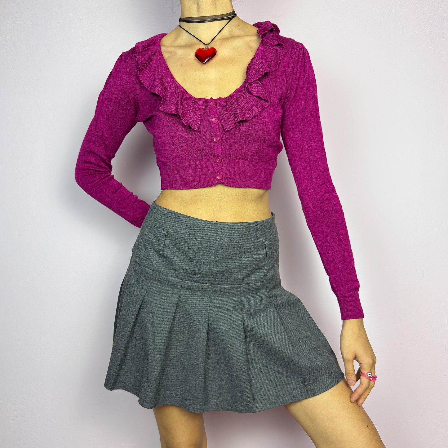 The Y2K Gray Pleated Mini Skirt is a vintage 2000s essential, featuring a structured pleated design and a side zipper closure. Made from a thick woven fabric, is perfect for preppy, grunge, or casual outfits. adult world shop