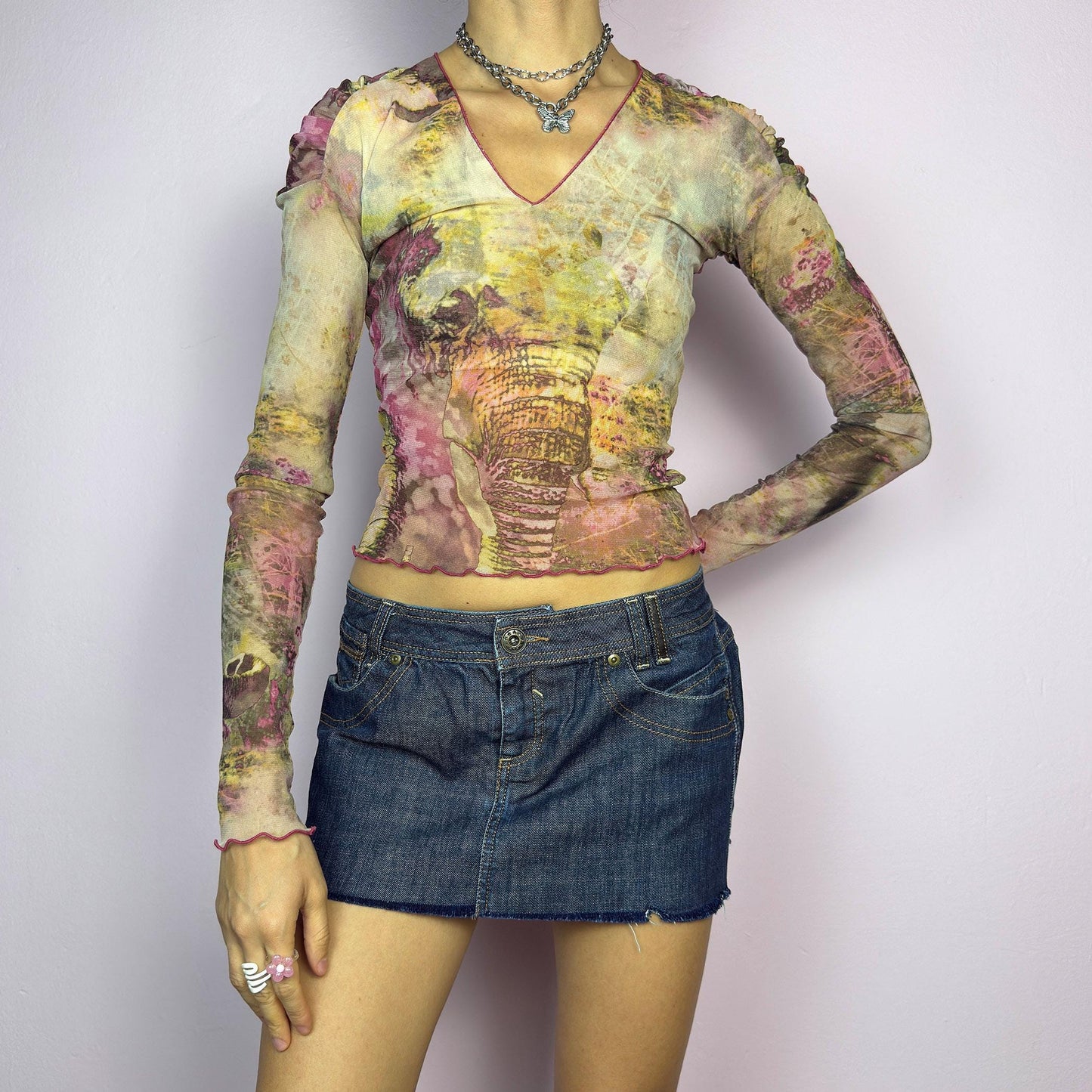 The Y2K Dark Denim Low-Rise Micro Mini Skirt is a vintage 2000s staple, featuring a short micro fit with a low-rise waist and a raw hem for an effortlessly edgy look. Crafted from dark-wash denim with contrast stitching. adult world shop