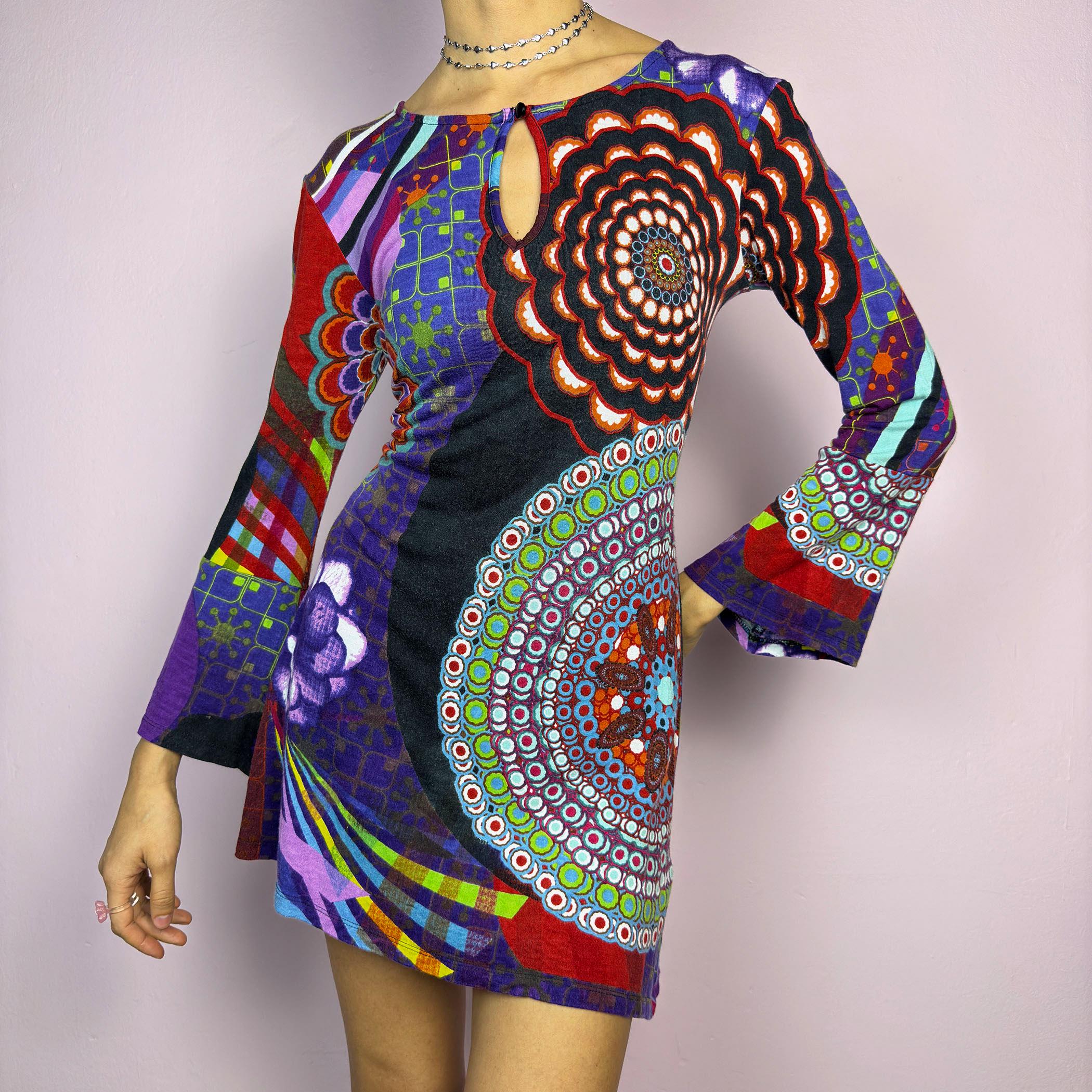 The Y2K Psychedelic Print Mini Dress is a statement 2000s piece, featuring a bold and colorful abstract pattern with a mix of geometric and floral designs and is crafted from a stretchy fabric. adult world shop