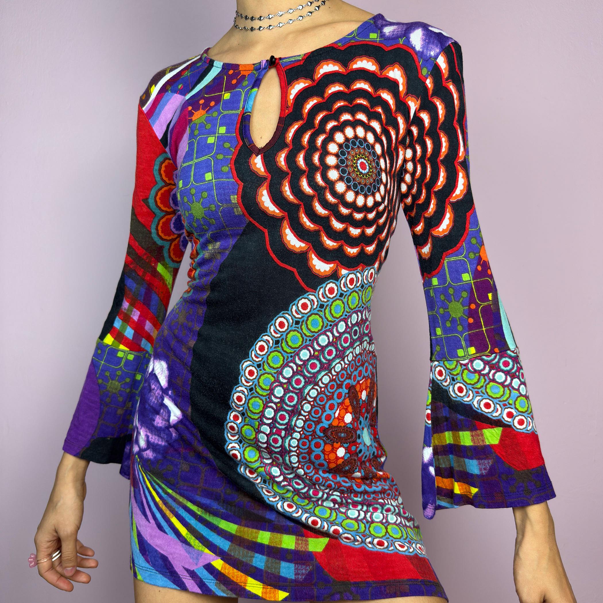 The Y2K Psychedelic Print Mini Dress is a statement 2000s piece, featuring a bold and colorful abstract pattern with a mix of geometric and floral designs and is crafted from a stretchy fabric. adult world shop