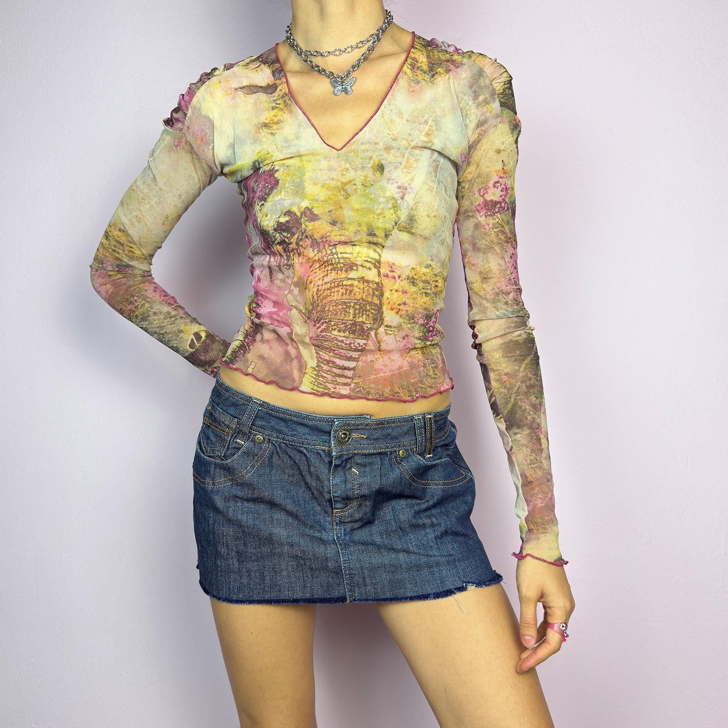 The Y2K Dark Denim Low-Rise Micro Mini Skirt is a vintage 2000s staple, featuring a short micro fit with a low-rise waist and a raw hem for an effortlessly edgy look. Crafted from dark-wash denim with contrast stitching. adult world shop