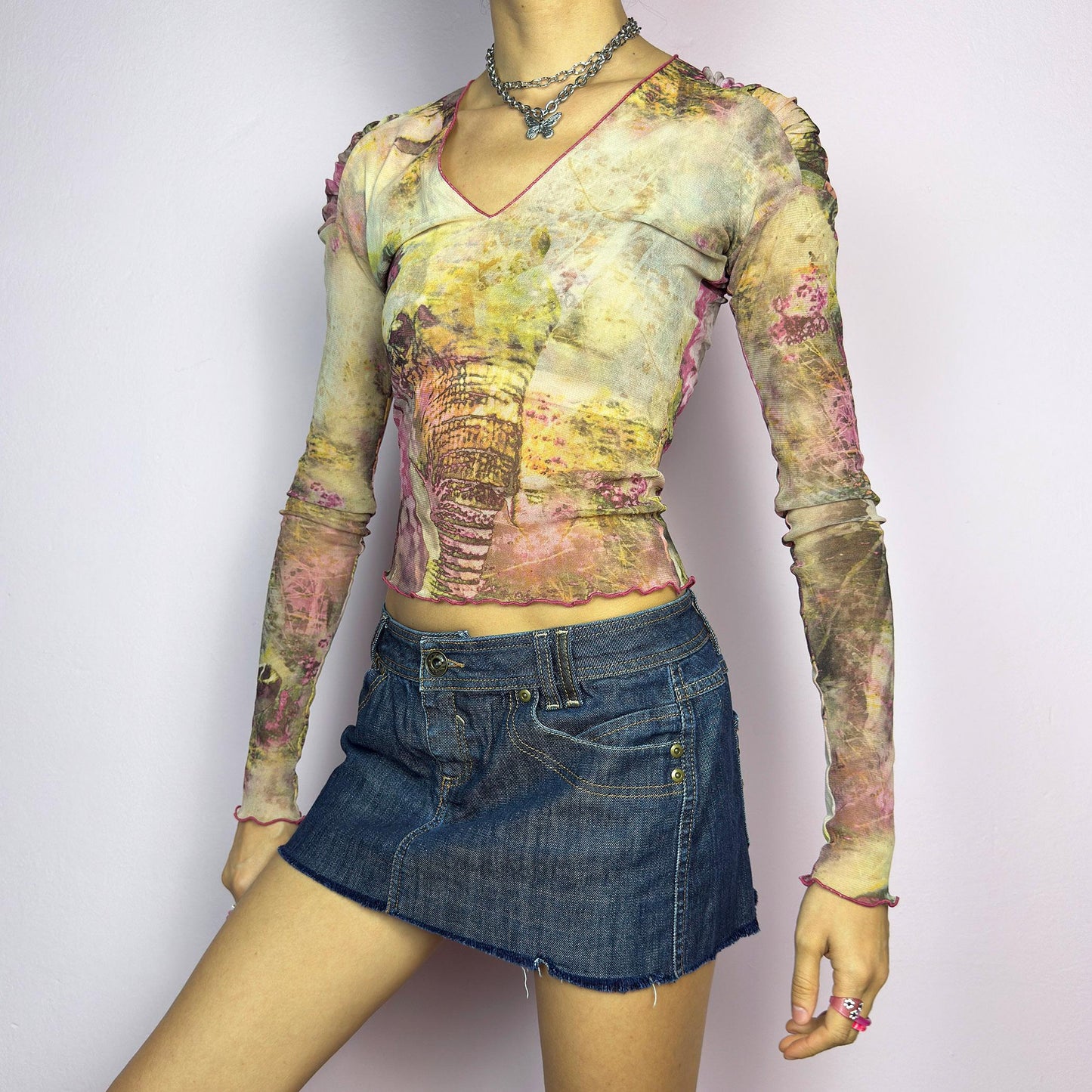 The Y2K Dark Denim Low-Rise Micro Mini Skirt is a vintage 2000s staple, featuring a short micro fit with a low-rise waist and a raw hem for an effortlessly edgy look. Crafted from dark-wash denim with contrast stitching. adult world shop