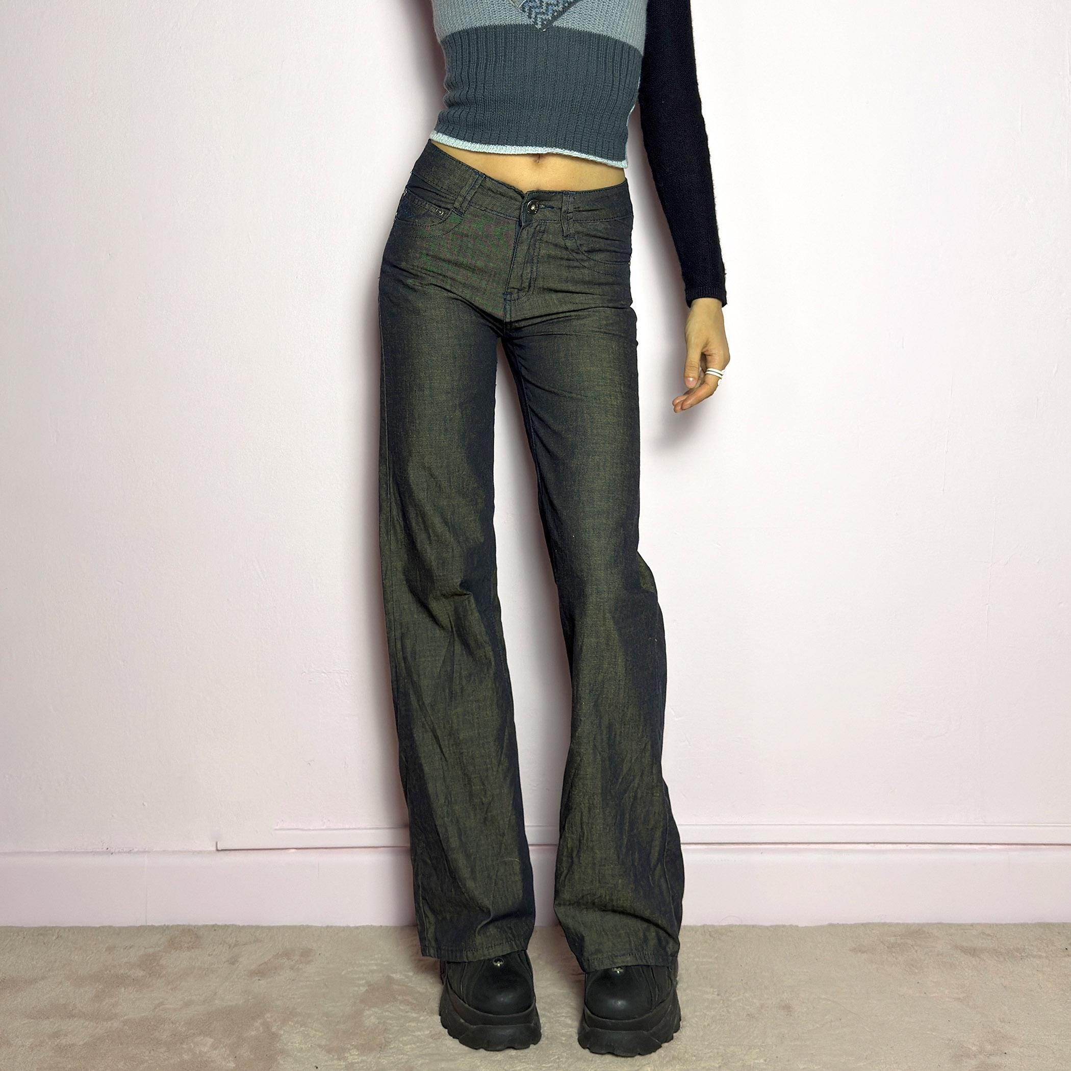 The Y2K Dark Rust Wide Jeans are a vintage 2000s statement piece featuring a structured denim fabric with a unique rust-effect wash, adding a worn-in, vintage appeal. Designed with a high-rise fit, button and zipper closure, and pockets, these jeans have a relaxed wide-leg silhouette that creates an effortlessly cool look. Perfect for edgy streetwear and casual outfits. adult world shop