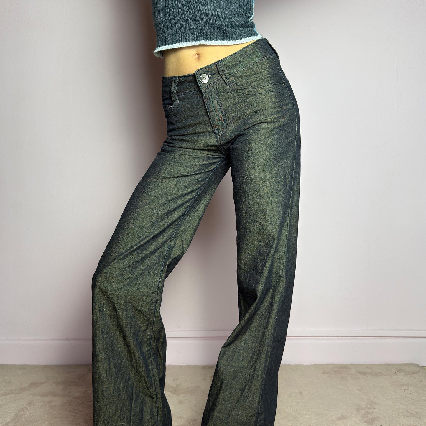 The Y2K Dark Rust Wide Jeans are a vintage 2000s statement piece featuring a structured denim fabric with a unique rust-effect wash, adding a worn-in, vintage appeal. Designed with a high-rise fit, button and zipper closure, and pockets, these jeans have a relaxed wide-leg silhouette that creates an effortlessly cool look. Perfect for edgy streetwear and casual outfits. adult world shop
