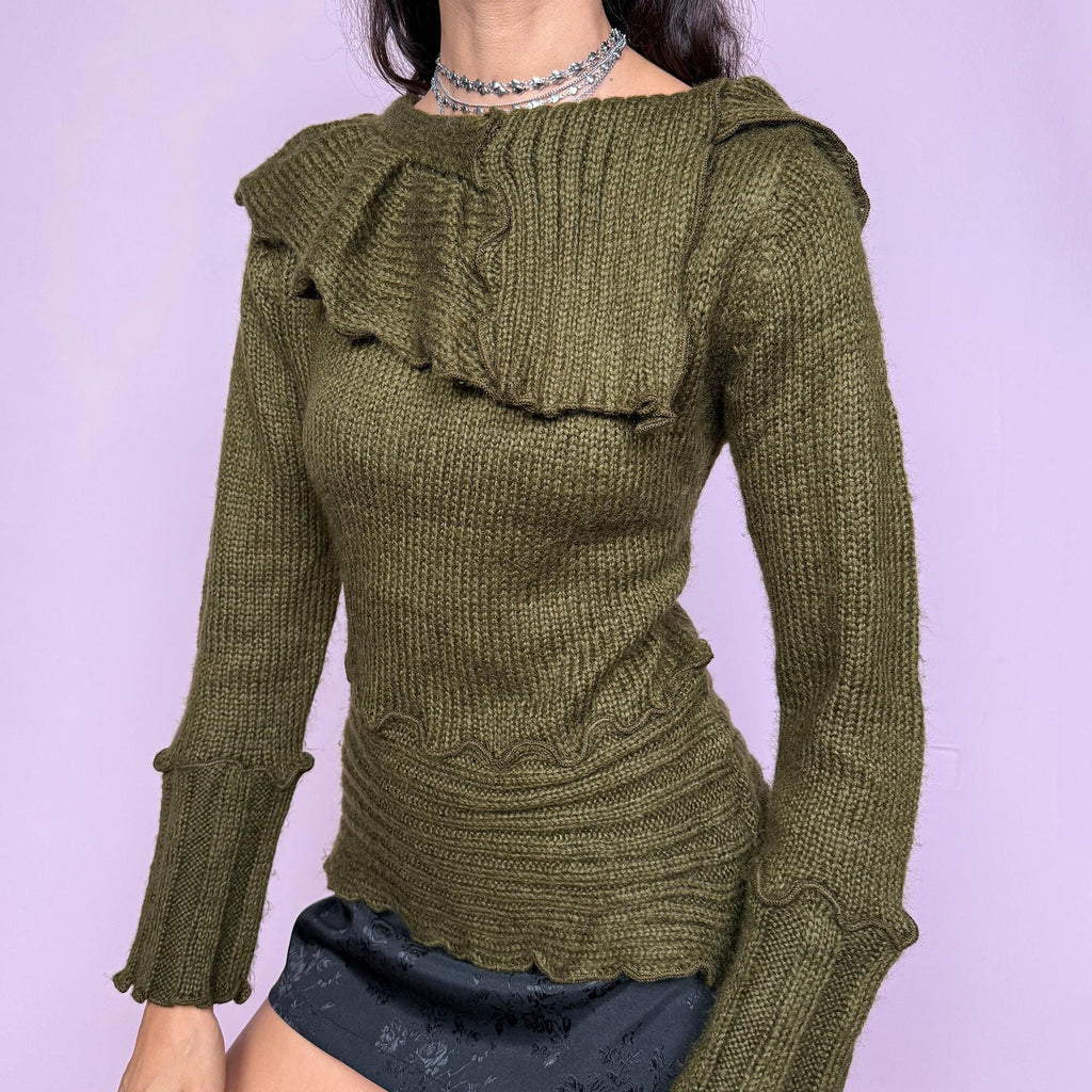 This vintage 2000s green sweater features a sculptural folded collar and wavy hems. This soft and warm mohair–acrylic blend piece embodies Y2K fairycore charm with forest-inspired elegance. Perfect for autumn layering or cozy winter styling—a whimsical archive knit. Made from mohair acrylic blend. Excellent vintage condition.