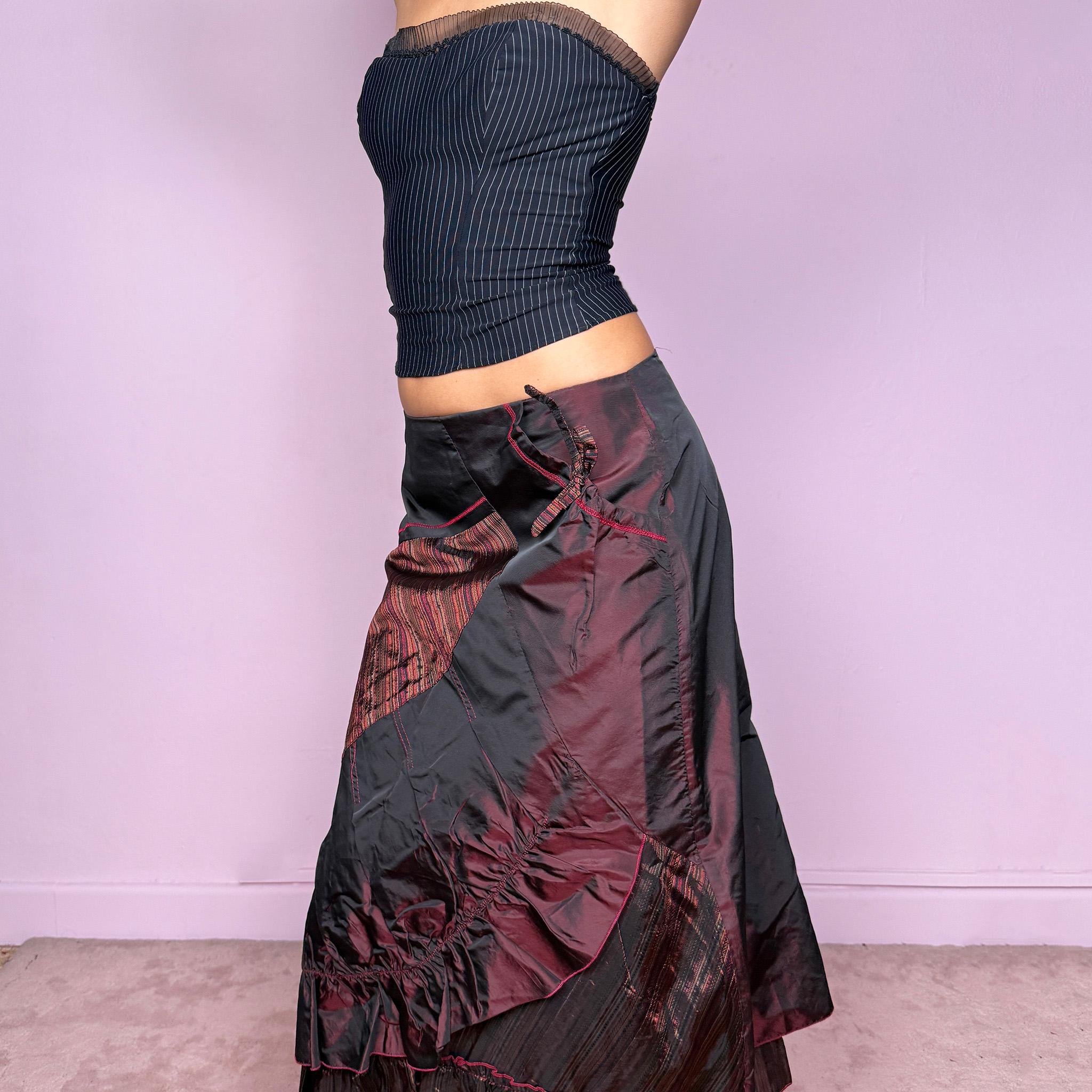 This stunning vintage 2000s maroon-burgundy flared midi skirt features a layered patchwork design with ruched detailing, ruffle hem, and back zipper closure. A whimsical fusion of fairy-grunge and deconstructed Y2K elegance, perfect for autumn nights, creative gatherings, or statement everyday wear. A rare, collectible piece with dark romance allure. It can be worn low to mid rise for size XS/S or high waisted for size M. Made from polyester acetate blend. Excellent vintage condition.