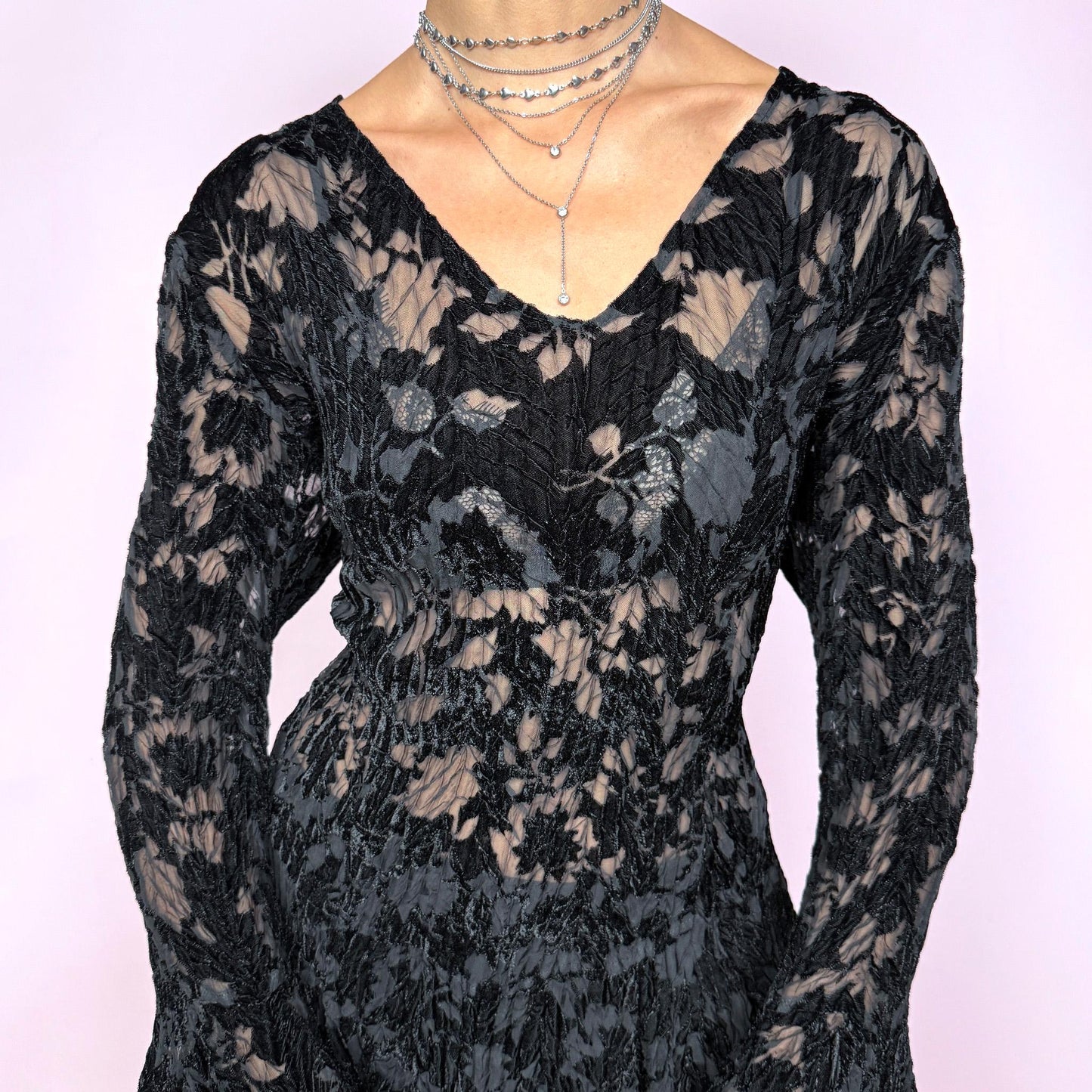 This vintage 2000s top features a dramatic black velvet devoré burnout design with sheer floral detailing, styled with asymmetric bell sleeves, a fitted silhouette, and an asymmetric flared hem. The piece delivers a dark romantic, goth, witchy aesthetic ideal for formal glam parties, festivals, and avant-garde evening wear. A rare archival French design blouse made from a stretchy devoré velvet blend. Excellent vintage condition.