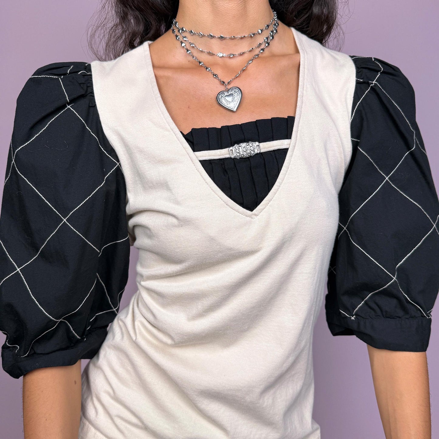 Vintage 90s cream cotton top with exaggerated black puff sleeves and a soft, stretchy body. The medieval-inspired sleeve shape adds dramatic volume, giving the piece a strong cottagecore feel. Perfect for a statement everyday outfit, a themed event or summer party looks. Made from cotton. Great vintage condition.