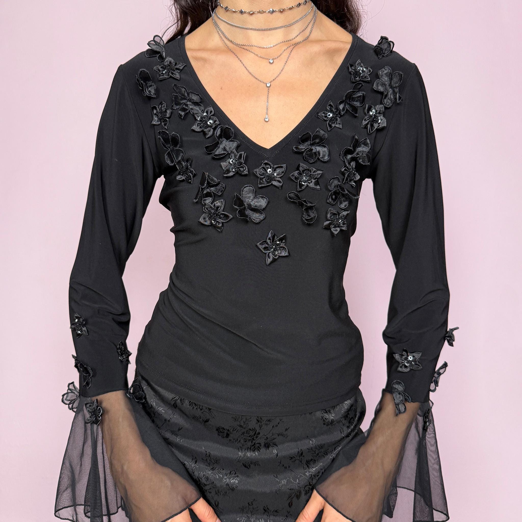 Dark romantic witchy vintage 2000s black top with sheer mesh long bell sleeves. Features floral appliqué with beaded sequin details and a V neckline. Stretchy fabric. Whimsical fairy and goth aesthetic, ideal for parties, elegant events, or night styling. Great vintage condition.