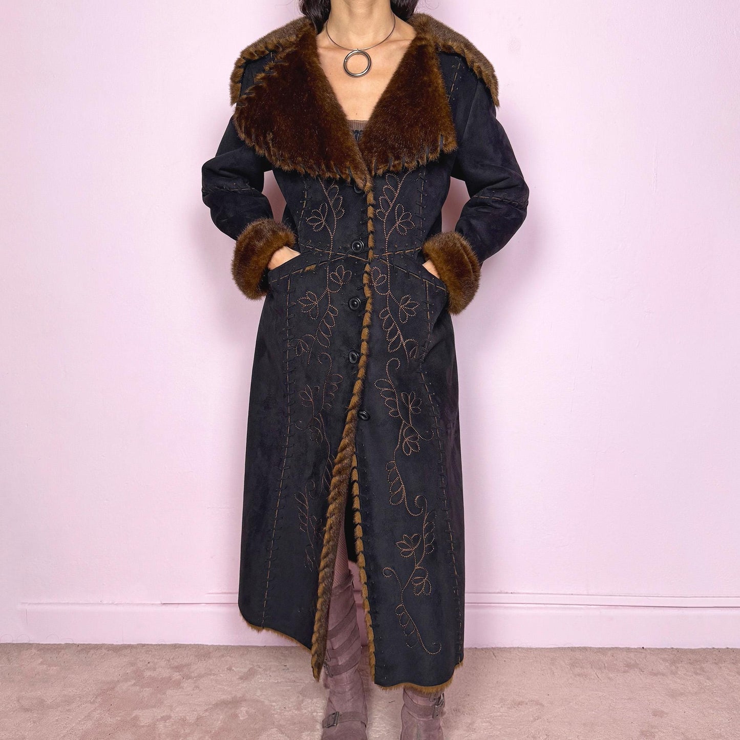 Stunning vintage 2000s dark gray almost black long Penny Lane coat with brown faux fur interior, collar, and cuffs. Features intricate floral embroidery, pockets, and button front closure. Soft faux suede with a warm feel, ideal for whimsical fairycore, boho, forest muse, and 70s Afghan-inspired Y2K styling. French-designed piece. Made from polyester. Excellent vintage condition.