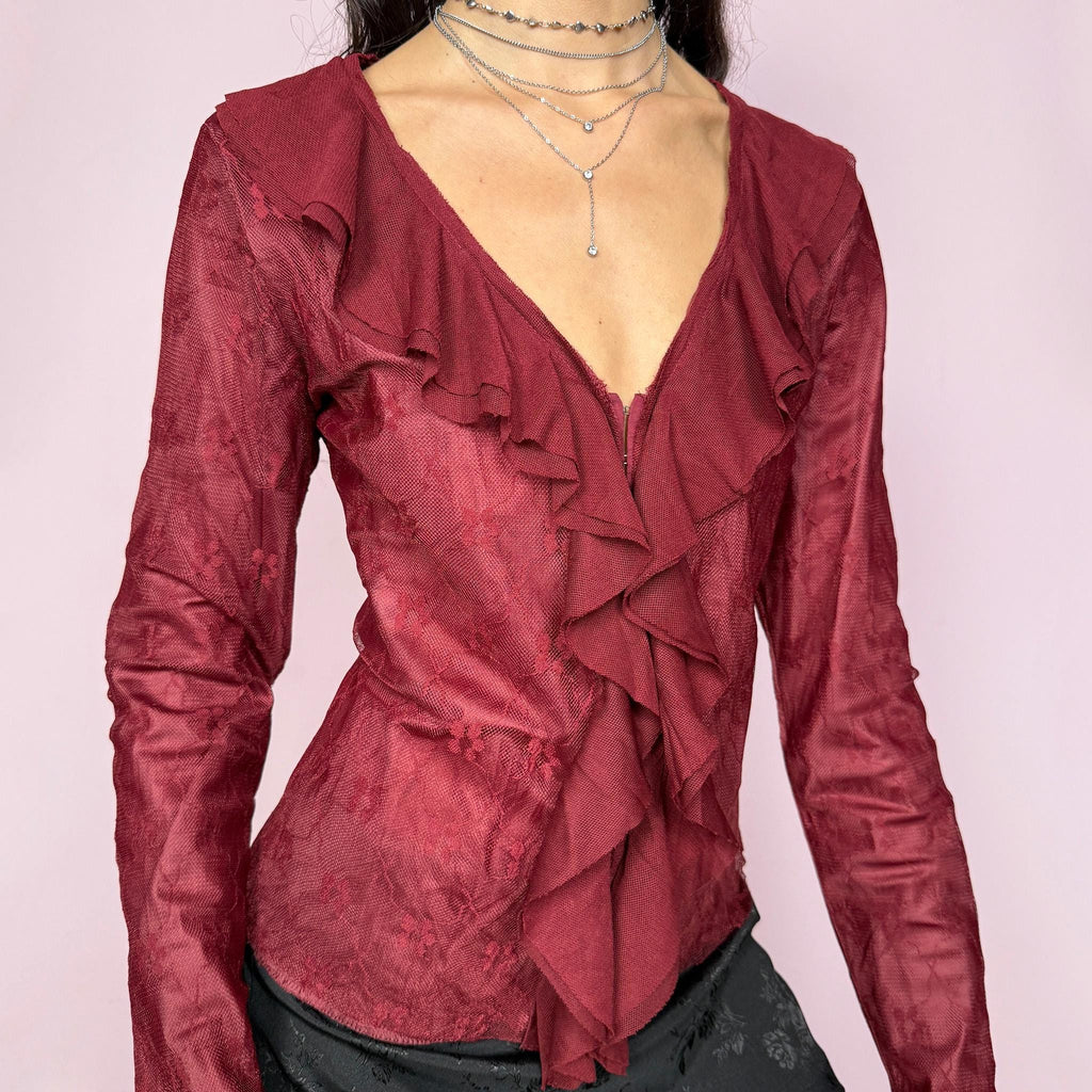 Romantic vintage 2000s maroon burgundy lace top featuring long bell sleeves with ruffle cuffs, ruffled V neckline, and front hook closure. Whimsical fairy-inspired style for night outings, parties, or elegant formal styling. Non-stretch fabric. Excellent vintage condition.