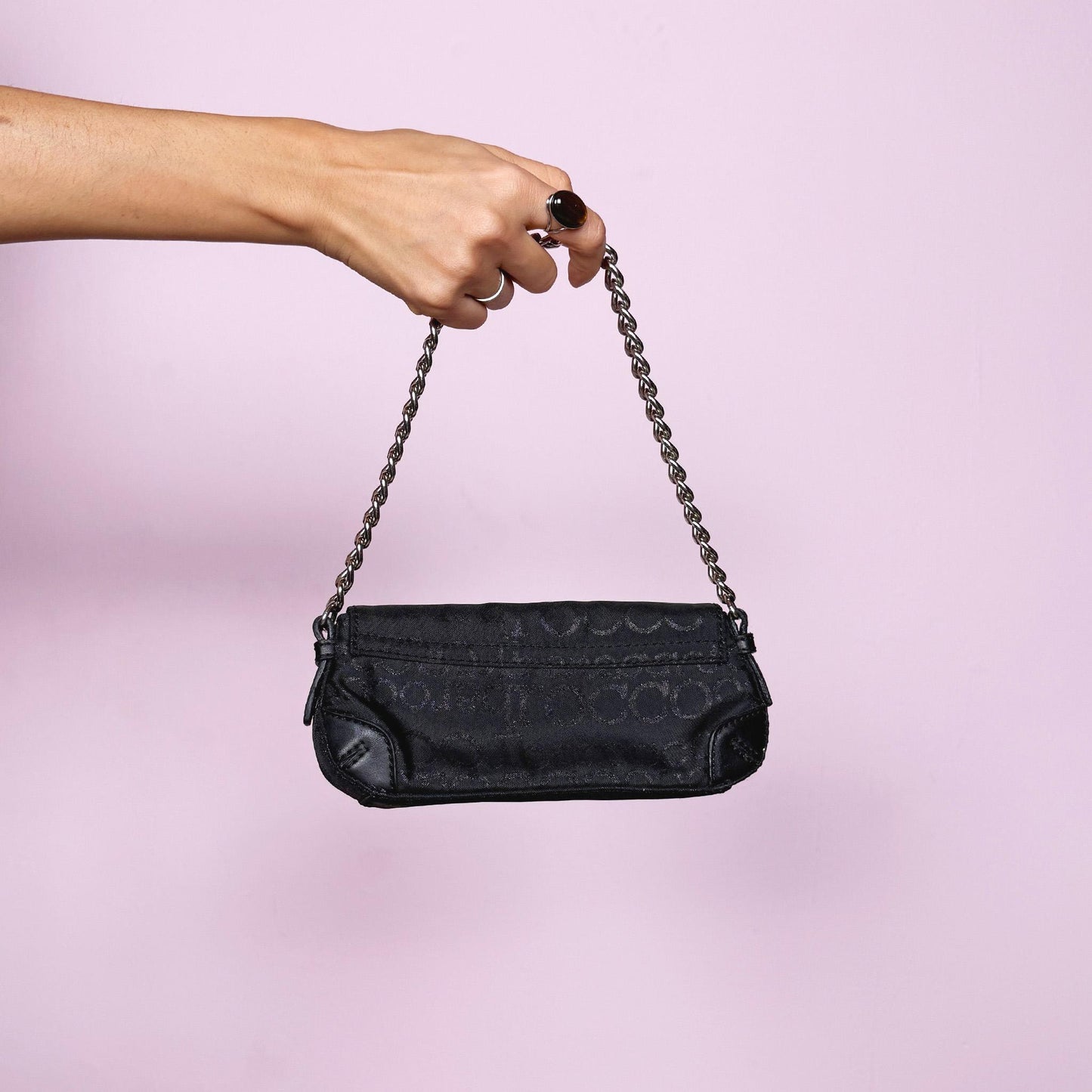 Vintage Y2K black mini baguette bag with shiny monogram finish, snap button closure, and chain shoulder strap. Iconic 2000s Italian design by Roccobarroco, ideal for party nights, events, and elegant glam Y2K styling. Made from polyester. Excellent vintage condition.