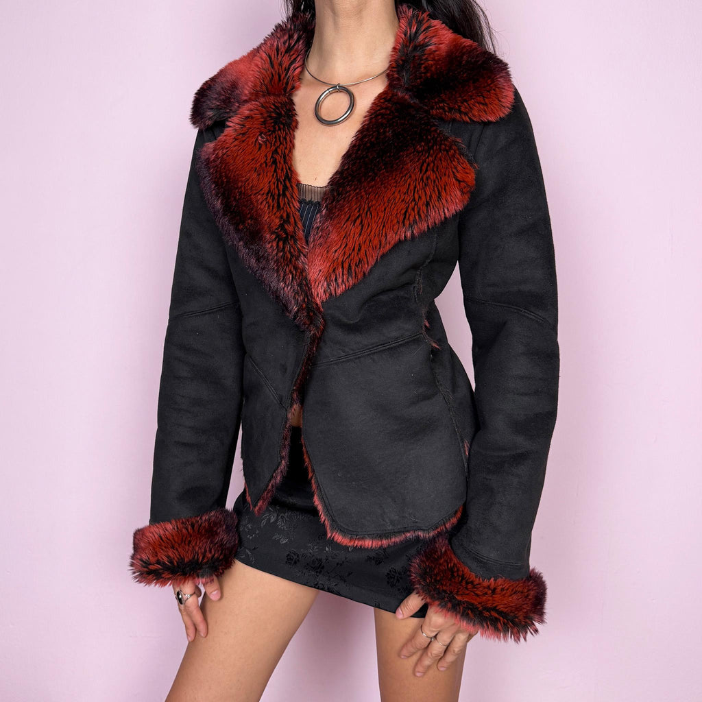 Stunning vintage 2000s Penny Lane–inspired jacket featuring a black faux suede exterior with bold red and black faux fur collar and cuffs. Designed with a fitted cut, single button closure, and front pockets. A statement piece made from polyester by a French brand. Excellent vintage condition.