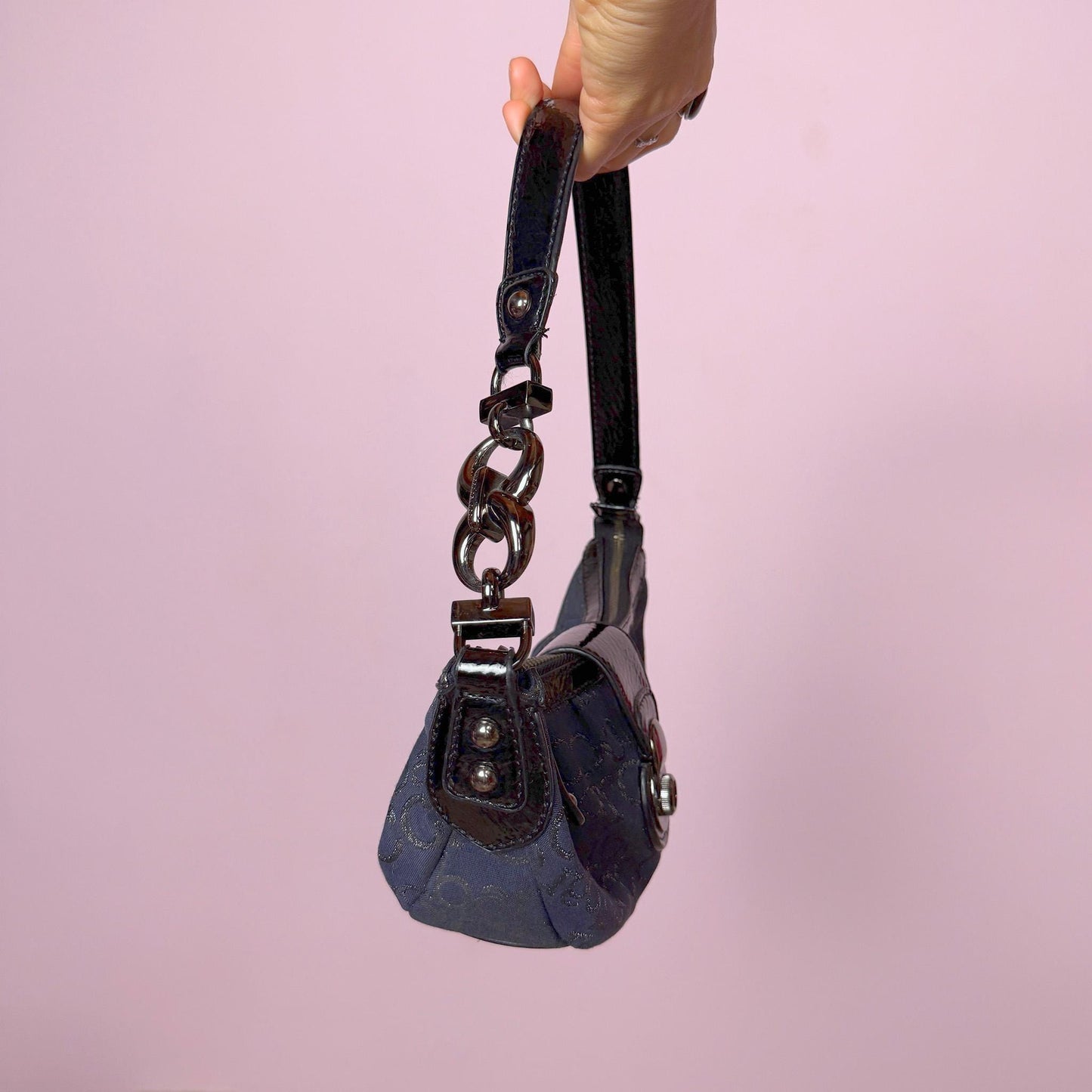 Iconic vintage early 2000s navy blue mini baguette bag by Roccobarocco. Features signature monogram canvas with glossy black patent details, sculptural hardware, zip closure, and push-down turn-lock closure. A quintessential Italian going-out accessory with a bold Y2K silhouette. Made in Italy. Great vintage condition.