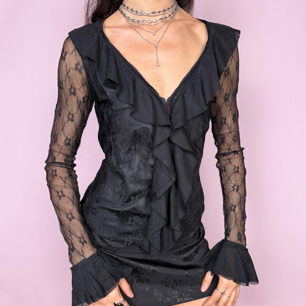 Dark romance vintage 2000s black lace blouse with sheer bell sleeves, ruffled V-neckline, and hook front closure. A whimsical fairy goth piece perfect for night outings, parties, or elegant events. Non-stretch fabric. By a French brand. Excellent vintage condition.