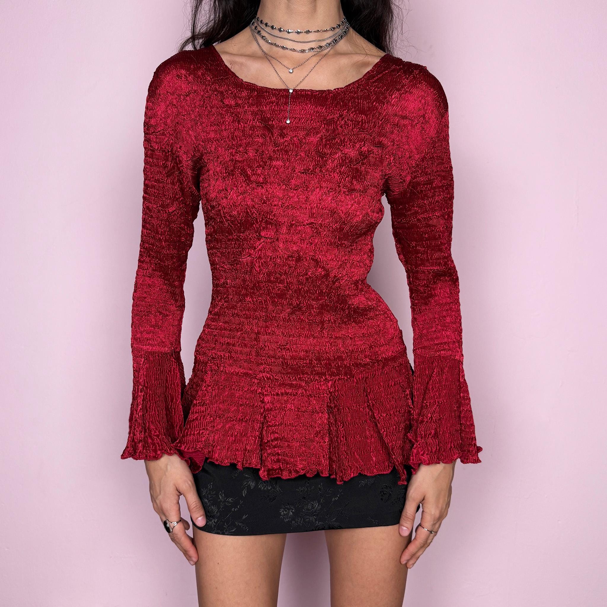 Stunning vintage 2000s burgundy maroon crinkle-pleated blouse featuring dramatic asymmetric bell sleeves, a fitted silhouette, and an asymmetric flared hem. Romantic and avant-garde, ideal for formal parties, festivals, or bold evening wear. Rare archival French design made from polyester by a French brand. Excellent vintage condition.