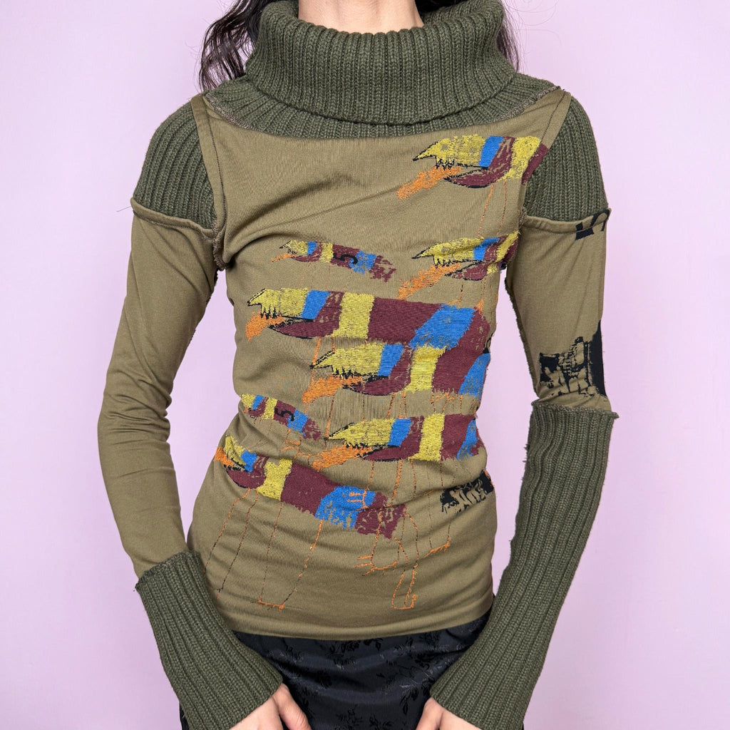 Avant garde vintage 2000s khaki green deconstructed long sleeve top with a knit turtleneck, ribbed knitted cuffs, and patchwork construction. Features multicolored embroidered details with a futuristic dystopian weird girl aesthetic. Ideal for autumn or winter statement layering. Made in Portugal from a stretchy polyamide blend by Desigual. Great vintage condition.