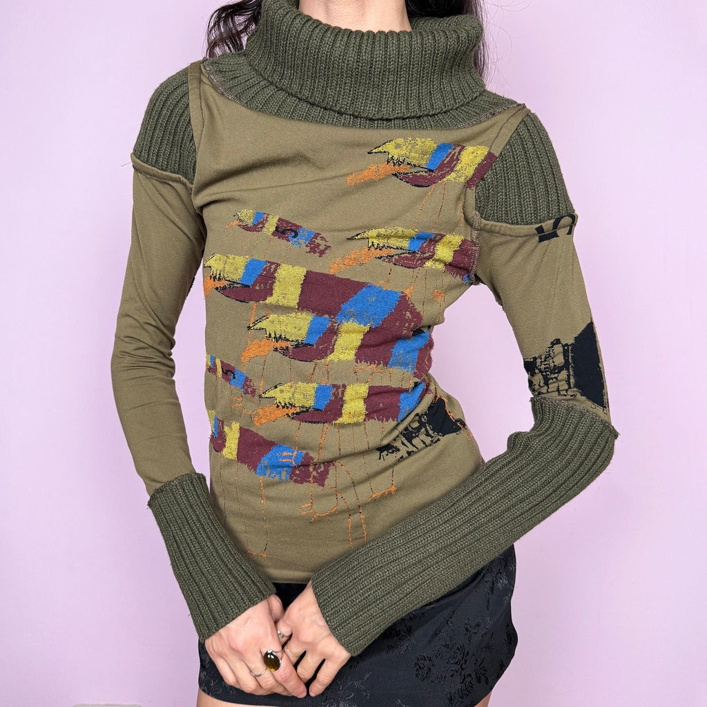 Avant garde vintage 2000s khaki green deconstructed long sleeve top with a knit turtleneck, ribbed knitted cuffs, and patchwork construction. Features multicolored embroidered details with a futuristic dystopian weird girl aesthetic. Ideal for autumn or winter statement layering. Made in Portugal from a stretchy polyamide blend by Desigual. Great vintage condition.