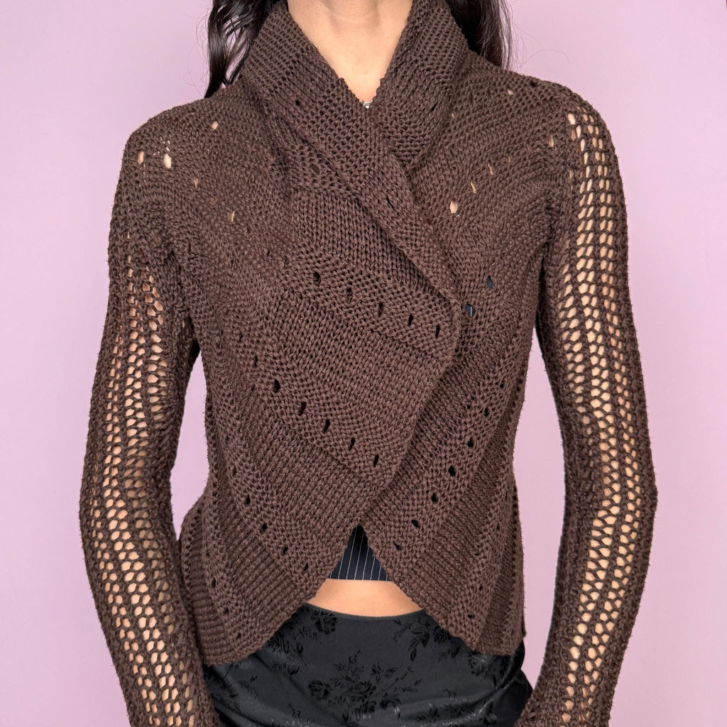 Boho fairycore vintage 2000s dark brown open knit cardigan with a sheer finish and long bell sleeves. Features a folded draped neckline and open front with no closure. Lightweight and stretchy, designed for avant garde autumn or spring layering. Can be worn multiple ways and styled with a safety pin or brooch for a custom fit. Great vintage condition.
