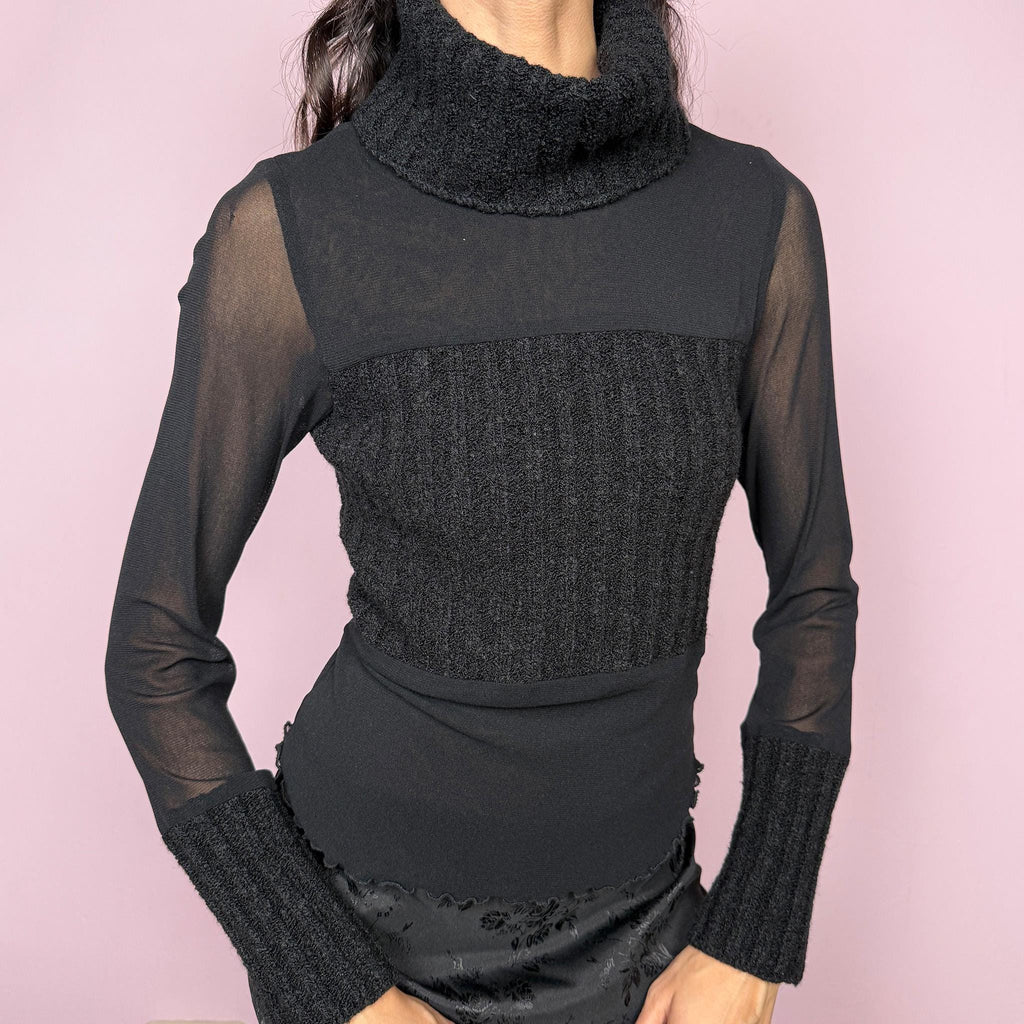 Avant garde minimalist vintage 2000s black deconstructed long sleeve top featuring a knit turtleneck, ribbed knitted cuffs, and patchwork construction with mesh and semi-sheer panels. Designed for futuristic dystopian weird girl aesthetic layering with a fitted silhouette. Stretchy polyamide fabric. Made in Italy. Great vintage condition.