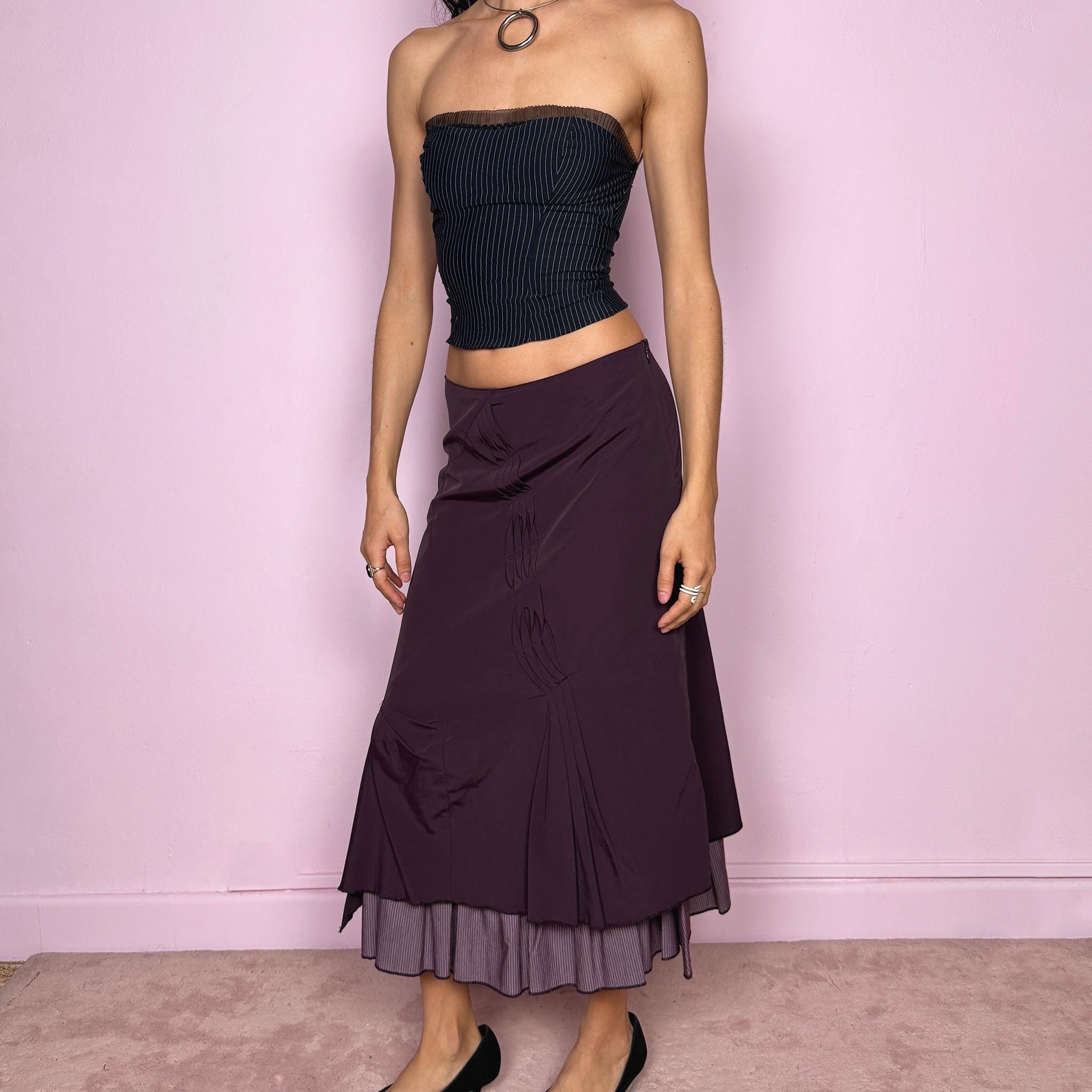 Vintage 2000s avant garde purple midi skirt with a deconstructed draped design, ruched detailing, and an asymmetric ruffle hem. Side zip closure with no stretch. Can be worn mid rise for size S or high waisted for size M. Made by a French brand. Excellent vintage condition.