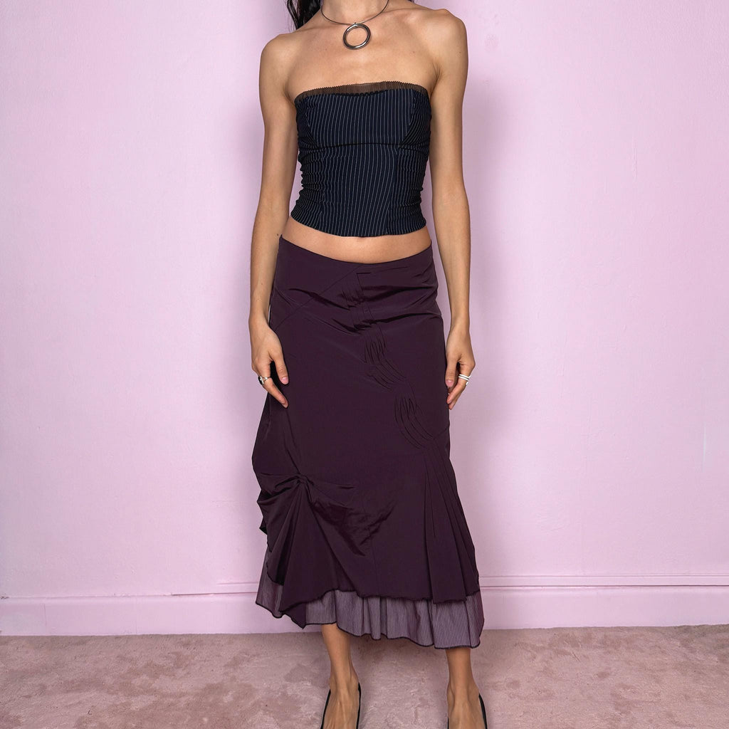 Vintage 2000s avant garde purple midi skirt with a deconstructed draped design, ruched detailing, and an asymmetric ruffle hem. Side zip closure with no stretch. Can be worn mid rise for size S or high waisted for size M. Made by a French brand. Excellent vintage condition.