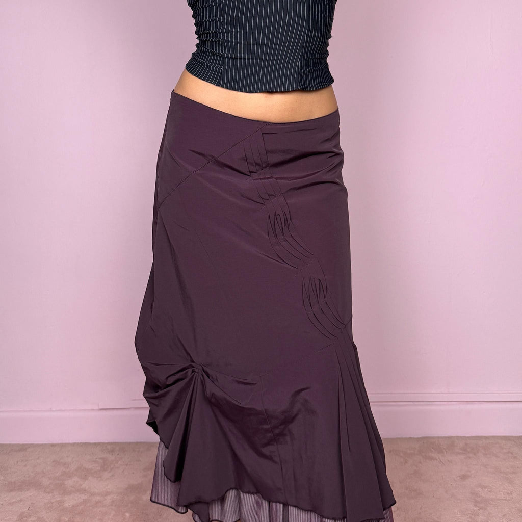 Vintage 2000s avant garde purple midi skirt with a deconstructed draped design, ruched detailing, and an asymmetric ruffle hem. Side zip closure with no stretch. Can be worn mid rise for size S or high waisted for size M. Made by a French brand. Excellent vintage condition.