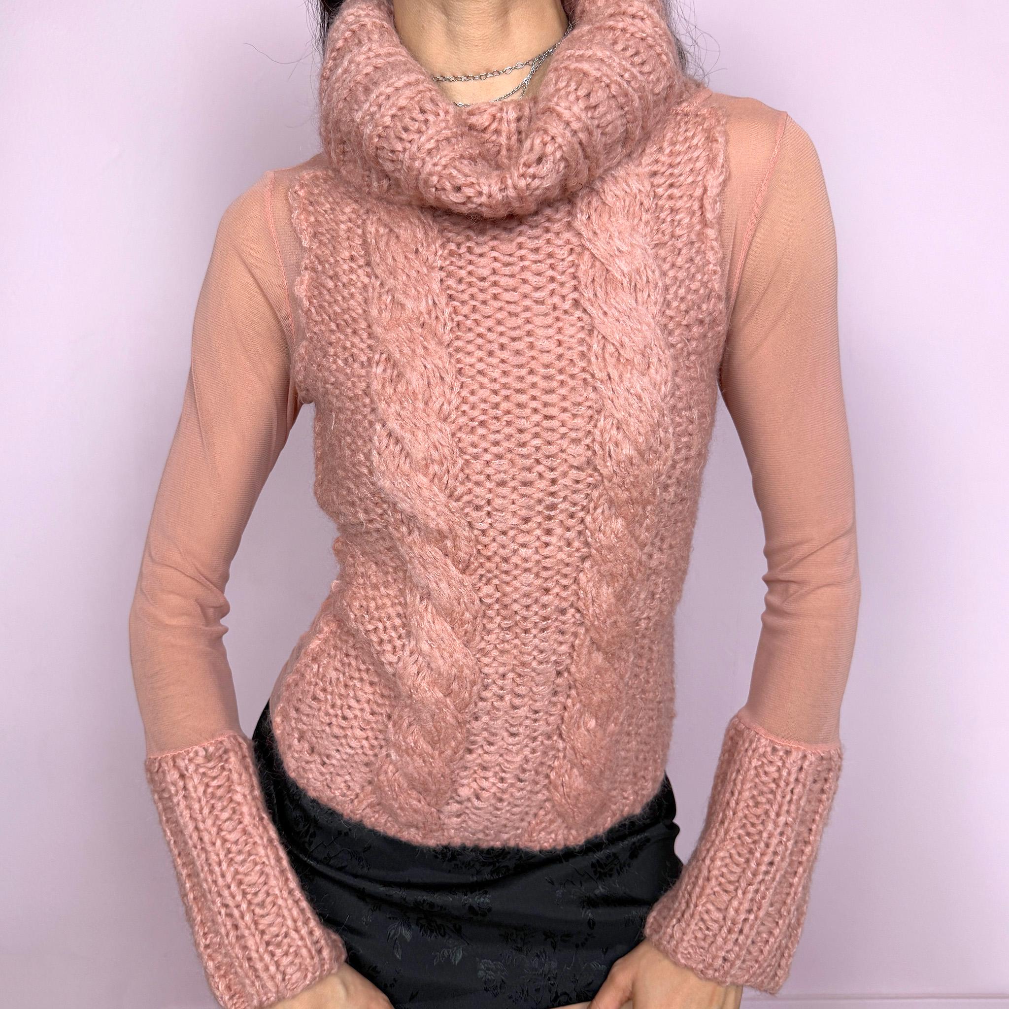 Vintage 2000s avant garde bi-material pink top with a turtleneck, cuffs, and cable knit front crafted from 40% mohair, 30% wool, and 20% acrylic, combined with semi sheer mesh polyamide panels. Stretchy with a fitted silhouette, blending soft coquette aesthetics with a unique deconstructed design. Made in Italy. Excellent vintage condition.