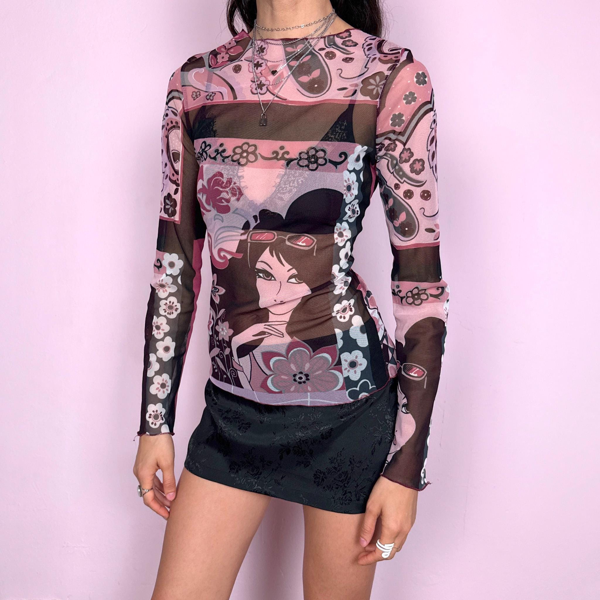 Vintage 2000s maximalist pink burgundy abstract floral graphic print mesh long sleeve semi sheer fitted stretchy top featuring a woman face motif. Lightweight with a bold statement design, perfect for spring or summer layering. Made in France from polyamide. Excellent vintage condition.