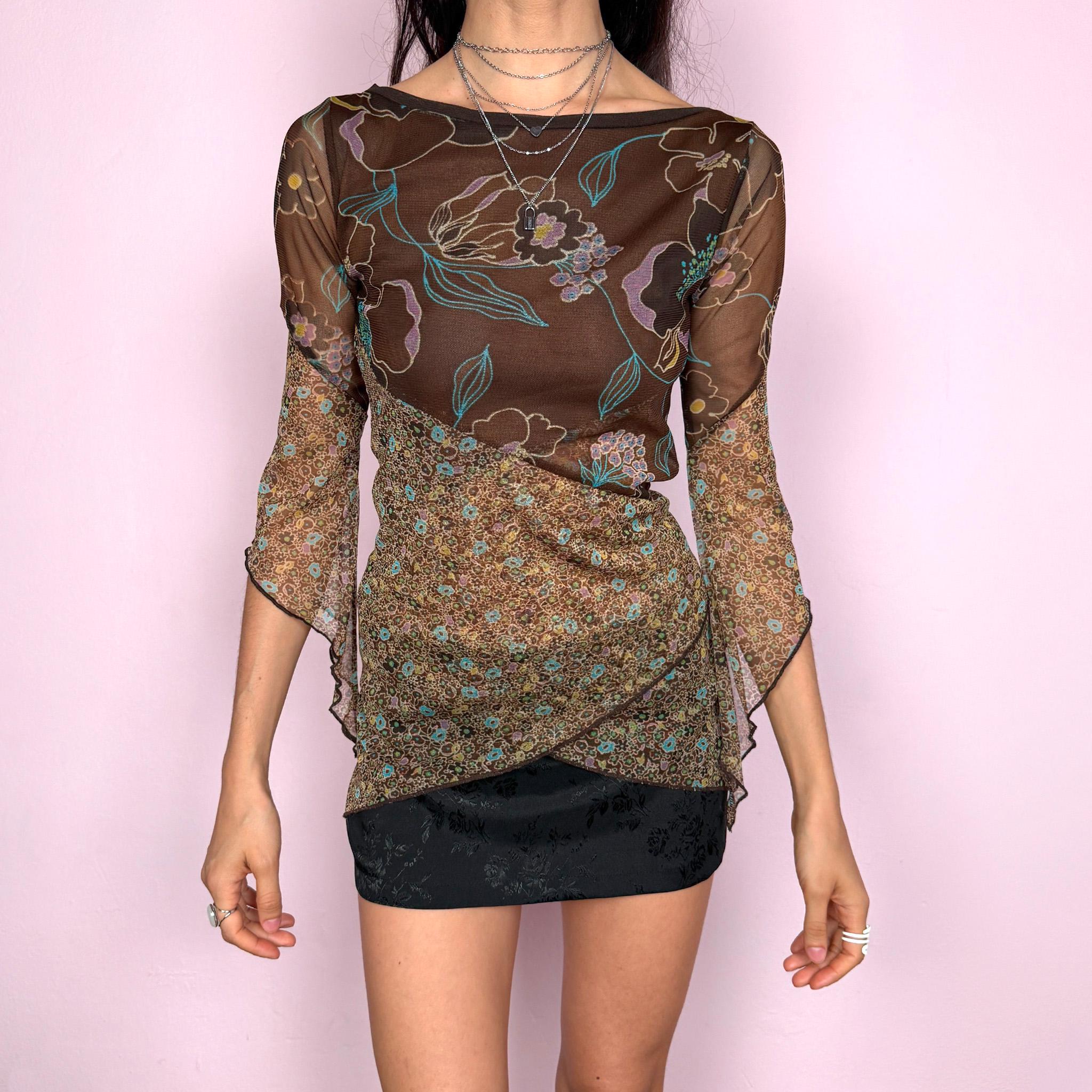 Vintage 2000s whimsical fairycore brown mesh 3/4 bell sleeve stretchy top with an asymmetric hem and two contrasting floral prints. Features a semi sheer lightweight feel with a fitted silhouette and flowing sleeves for a romantic look. Perfect for spring or summer wear. Made by a French brand. Excellent vintage condition.