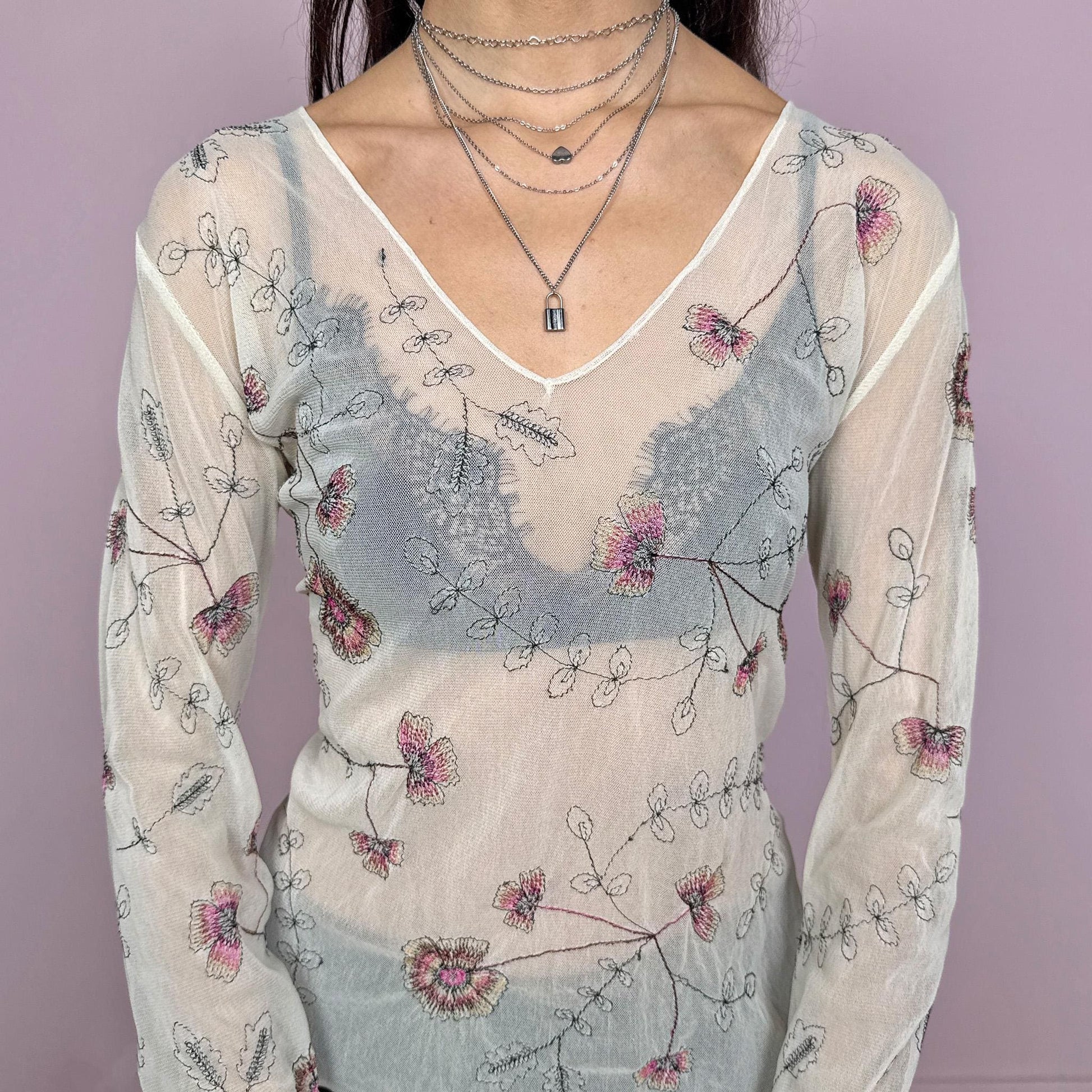 Vintage 2000s delicate soft ethereal cream mesh sheer long sleeve top with flared sleeves and a V-neck. Features floral embroidered details and a stretchy fitted silhouette with a subtle lettuce hem. Lightweight and airy, perfect for spring or summer layering with an artistic feel. Great vintage condition.
