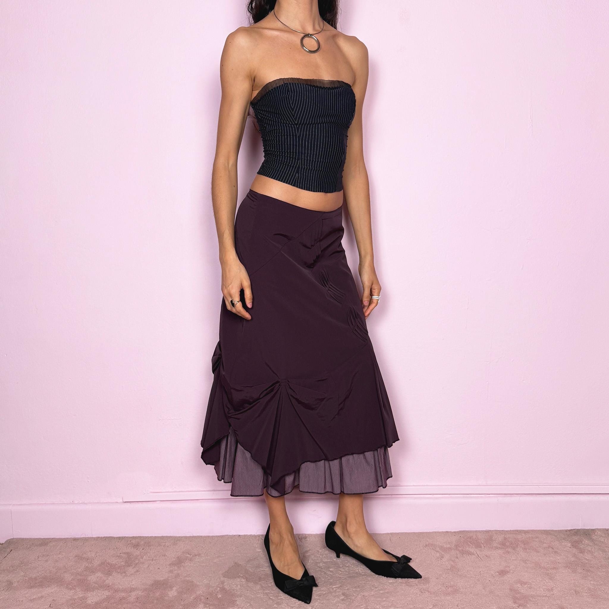 Vintage 2000s avant garde purple midi skirt with a deconstructed draped design, ruched detailing, and an asymmetric ruffle hem. Side zip closure with no stretch. Can be worn mid rise for size S or high waisted for size M. Made by a French brand. Excellent vintage condition.