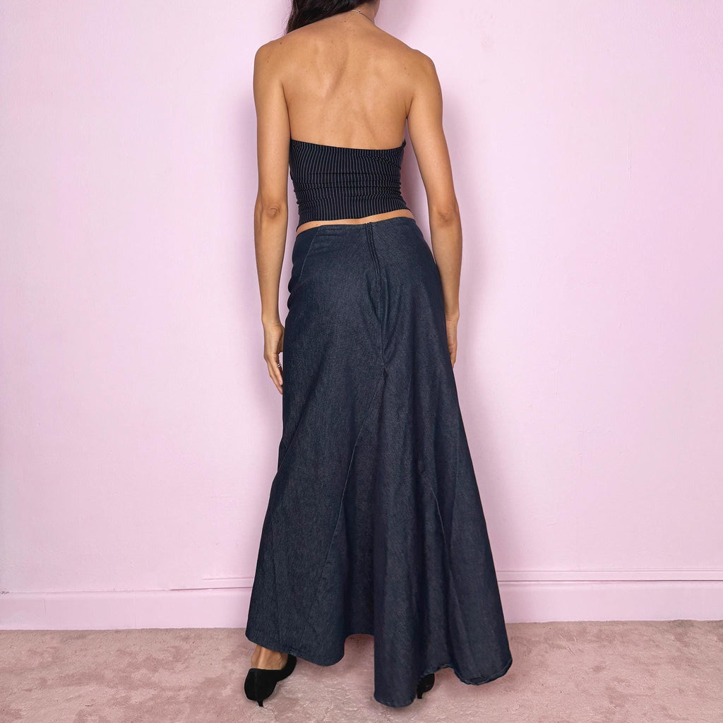 Vintage 2000s dark blue denim maxi skirt with an avant garde deconstructed design and asymmetric flared hem creating a sculptural silhouette. Back zip closure with stretch. Can be worn high waisted for size S or worn lower on the waist for size XS/XXS. Made in France from a cotton polyester blend. Excellent vintage condition.