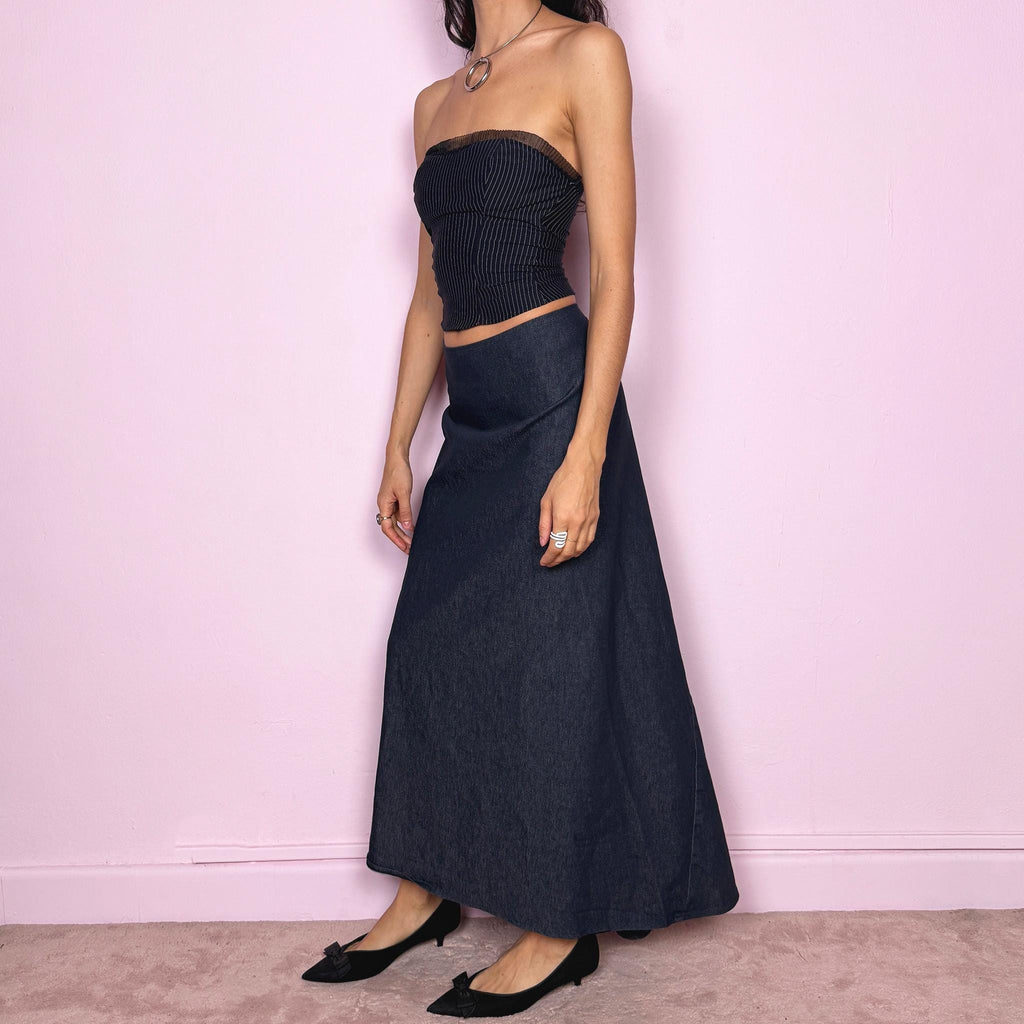 Vintage 2000s dark blue denim maxi skirt with an avant garde deconstructed design and asymmetric flared hem creating a sculptural silhouette. Back zip closure with stretch. Can be worn high waisted for size S or worn lower on the waist for size XS/XXS. Made in France from a cotton polyester blend. Excellent vintage condition.