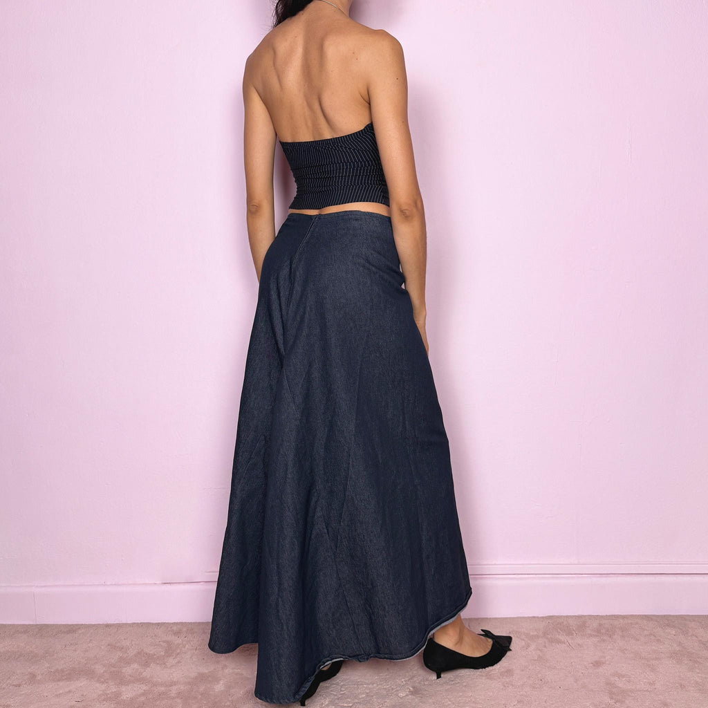 Vintage 2000s dark blue denim maxi skirt with an avant garde deconstructed design and asymmetric flared hem creating a sculptural silhouette. Back zip closure with stretch. Can be worn high waisted for size S or worn lower on the waist for size XS/XXS. Made in France from a cotton polyester blend. Excellent vintage condition.