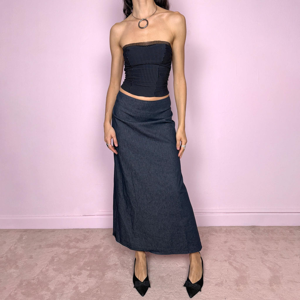 Vintage 2000s dark blue denim maxi skirt with an avant garde deconstructed design and asymmetric flared hem creating a sculptural silhouette. Back zip closure with stretch. Can be worn high waisted for size S or worn lower on the waist for size XS/XXS. Made in France from a cotton polyester blend. Excellent vintage condition.