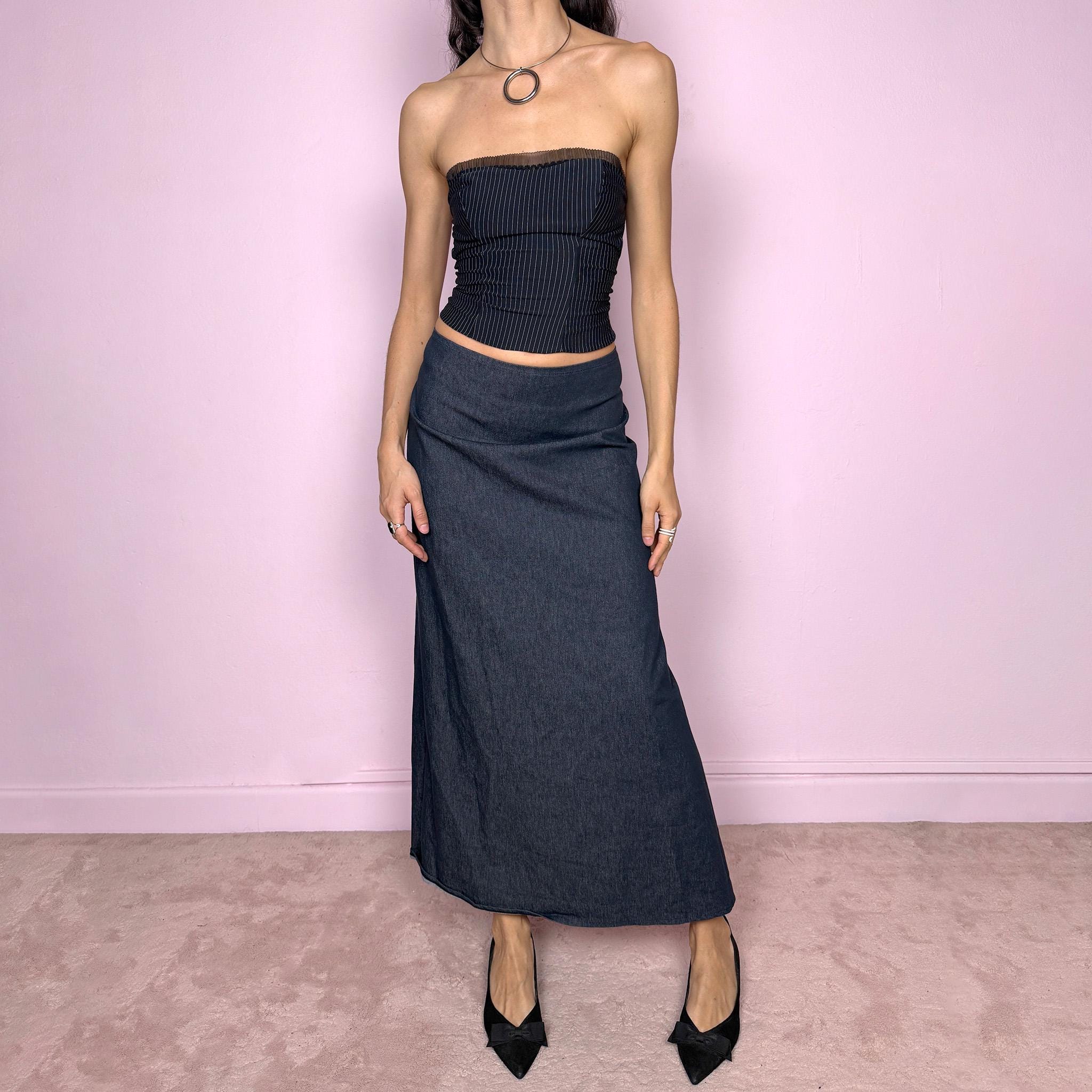 Vintage 2000s dark blue denim maxi skirt with an avant garde deconstructed design and asymmetric flared hem creating a sculptural silhouette. Back zip closure with stretch. Can be worn high waisted for size S or worn lower on the waist for size XS/XXS. Made in France from a cotton polyester blend. Excellent vintage condition.