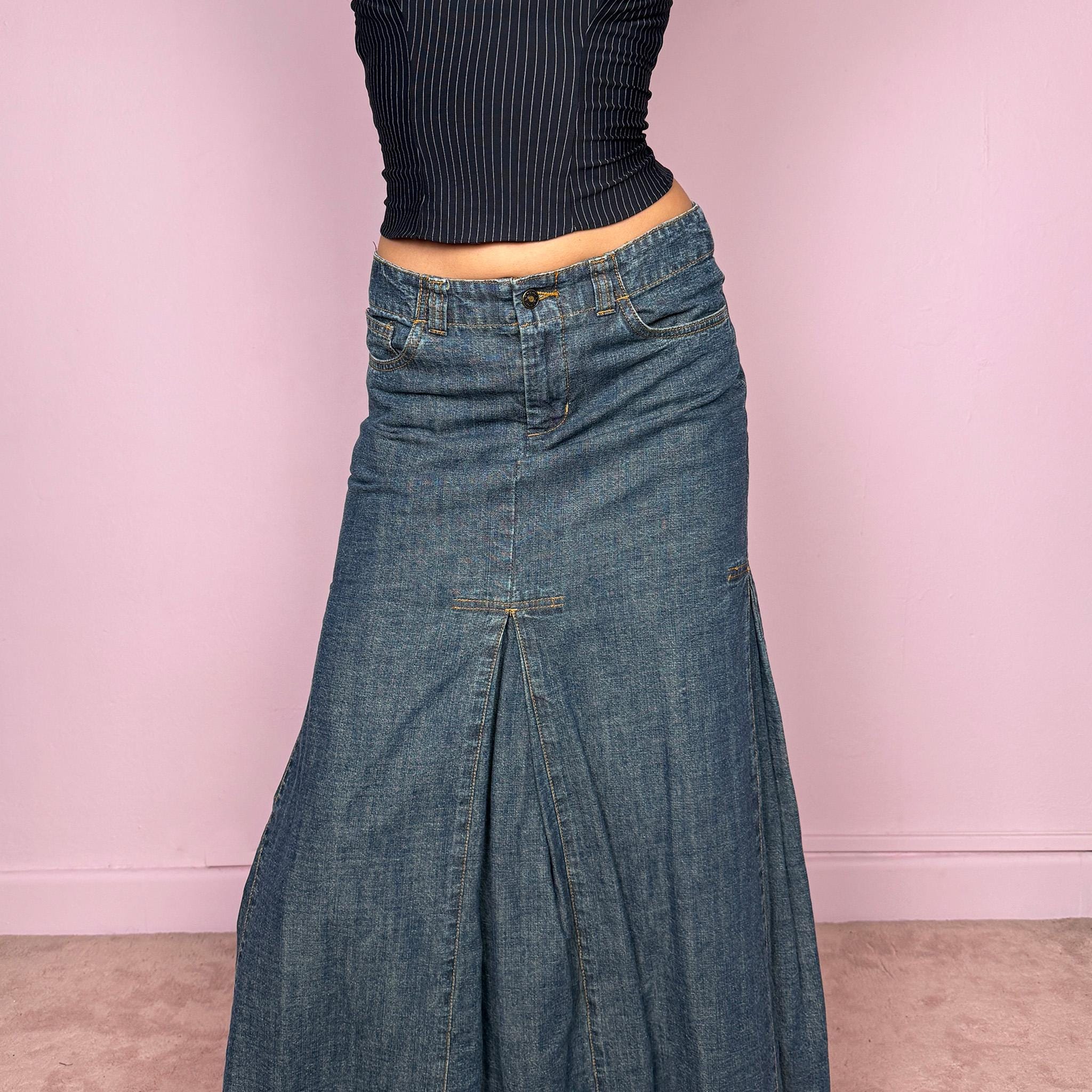 Vintage 2000s blue denim maxi skirt featuring a unique godet panel construction that creates a flared silhouette. Classic pockets and front zip closure. Structured denim with no stretch and a statement streetwear look. Can be worn mid rise for size XS or lower on the waist for size XXS. Made from 100% cotton. Excellent vintage condition.