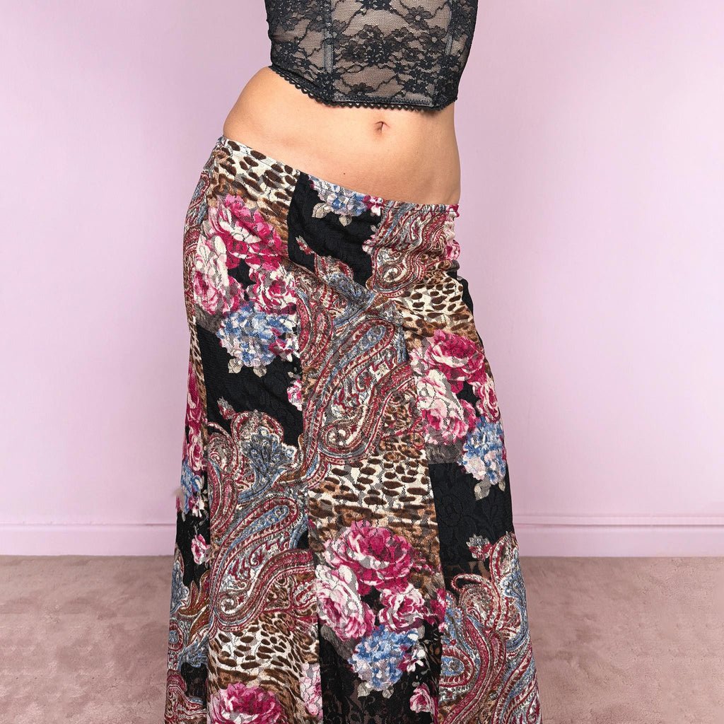 Vintage 2000s lace midi skirt with a whimsical maximalist mix of floral, paisley, and animal prints. Features multiple split hems and a stretchy elastic waistband for a flexible fit. Can be worn high waisted for size S or mid to low rise for XS. Made from a microfiber blend. Great vintage condition.