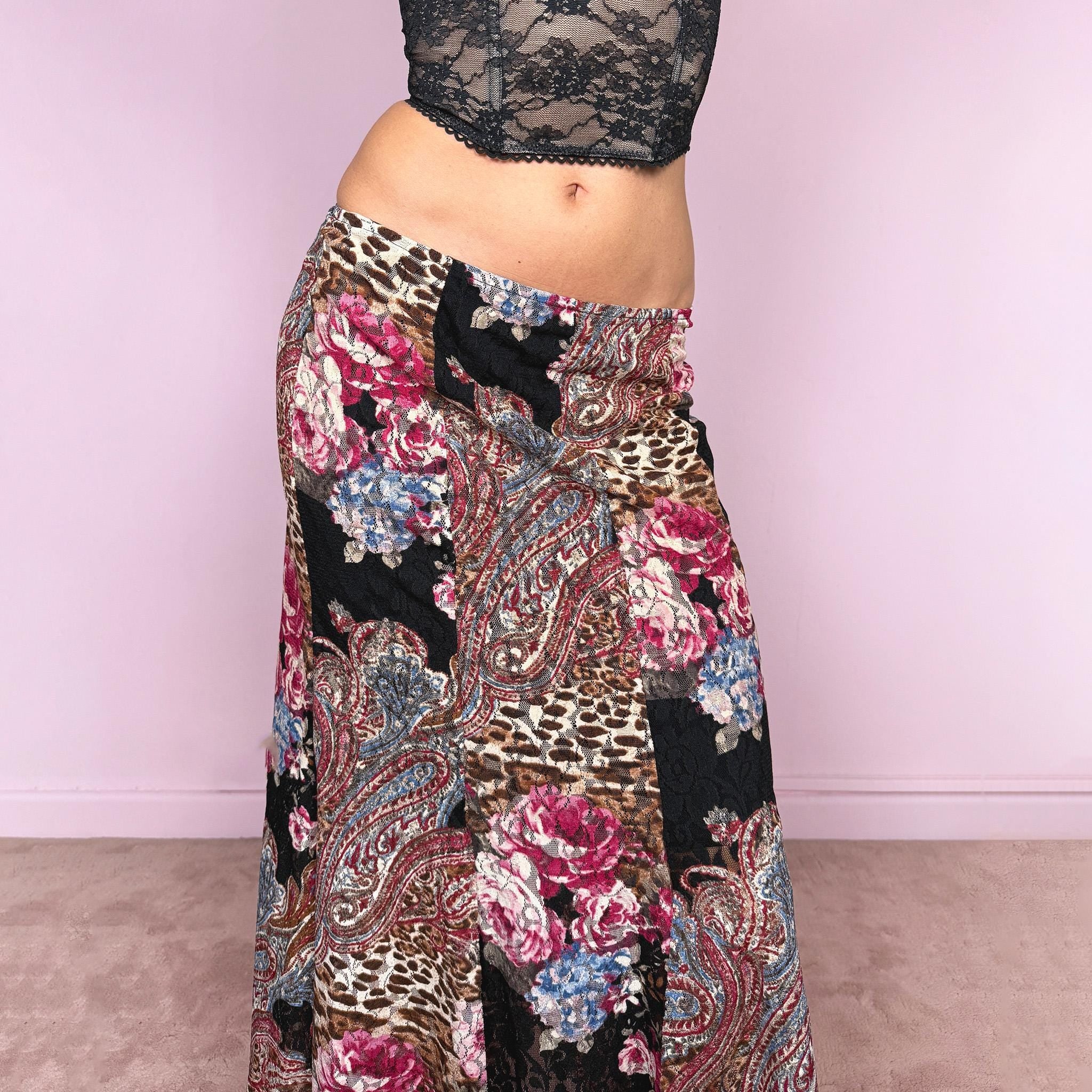 Vintage 2000s lace midi skirt with a whimsical maximalist mix of floral, paisley, and animal prints. Features multiple split hems and a stretchy elastic waistband for a flexible fit. Can be worn high waisted for size S or mid to low rise for XS. Made from a microfiber blend. Great vintage condition.