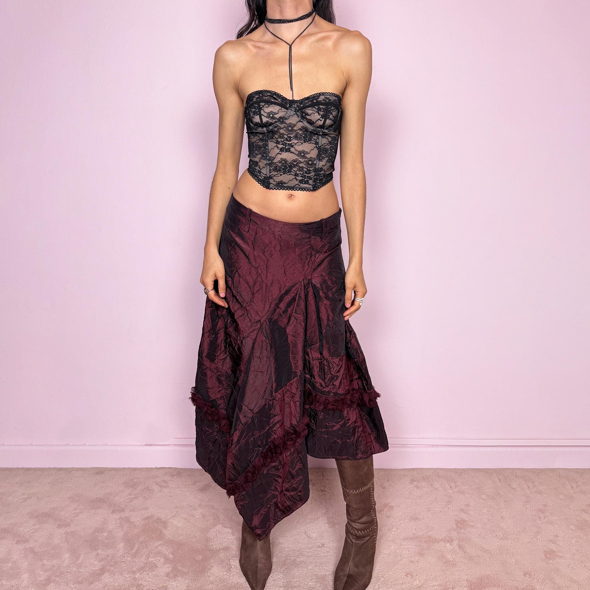 Vintage 2000s burgundy iridescent midi skirt with an avant garde experimental feel. Features a crinkle texture, asymmetric hem, and sculptural draped panels with rosette appliqué details. Voluminous and artistic silhouette with back zip closure, no stretch. Can be worn high waisted for size M or lower for XS/S. Made from polyester. Rare archive piece. Excellent vintage condition.