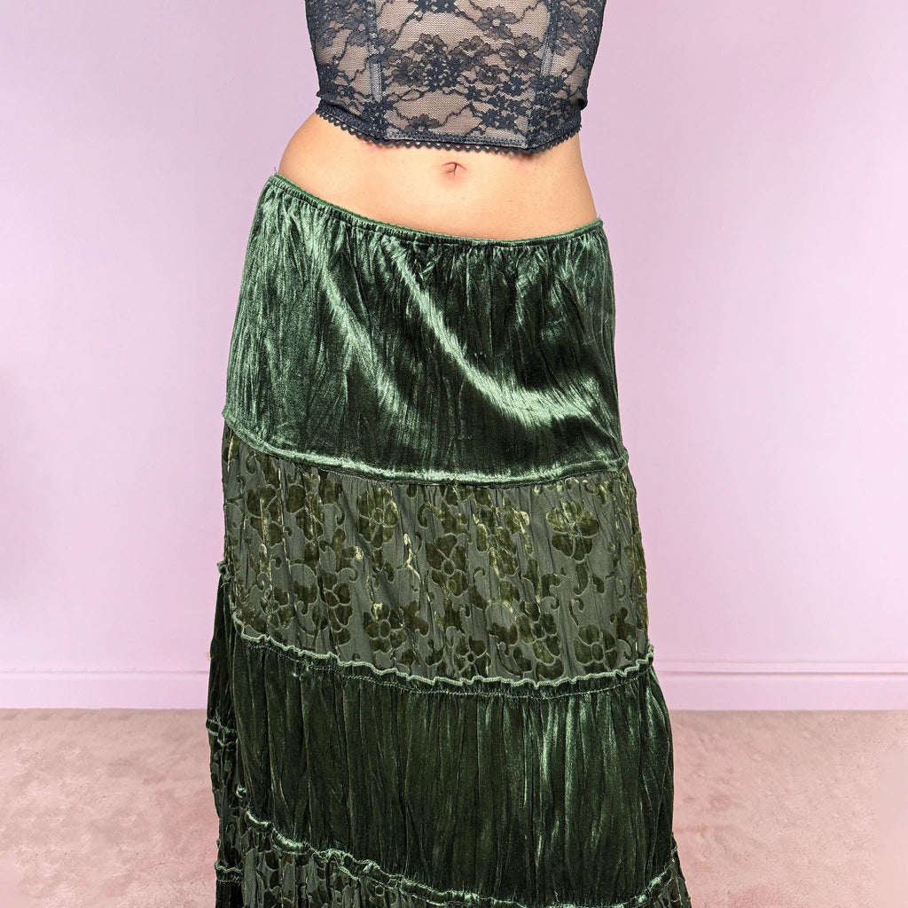 Vintage 2000s green velvet midi skirt with a whimsical fairycore boho feel. Features a tiered construction with burnout mesh floral panels and a soft crinkled texture. Stretchy elastic waistband for flexible fit. Can be worn high waisted for size M or lower for size S. Made by a French brand from polyester. Excellent vintage condition.