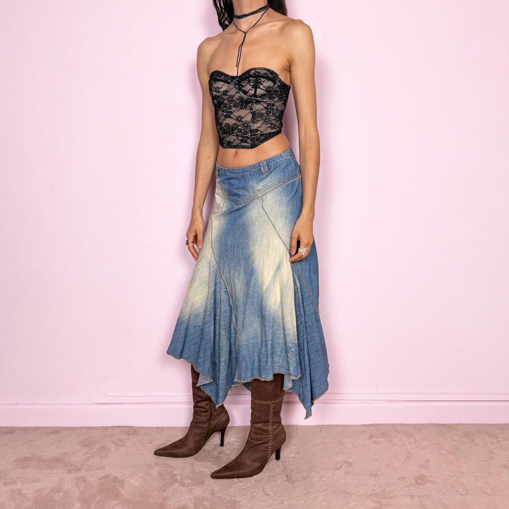 Vintage 2000s blue denim midi skirt with an avant garde flared asymmetric silhouette and panelled construction. Features a soft faded wash, raw hem detailing, and side zip closure, no stretch. Unique bold design perfect for summer festival styling. Can be worn high waisted for size M or mid to low rise for XS/S. Great vintage condition.